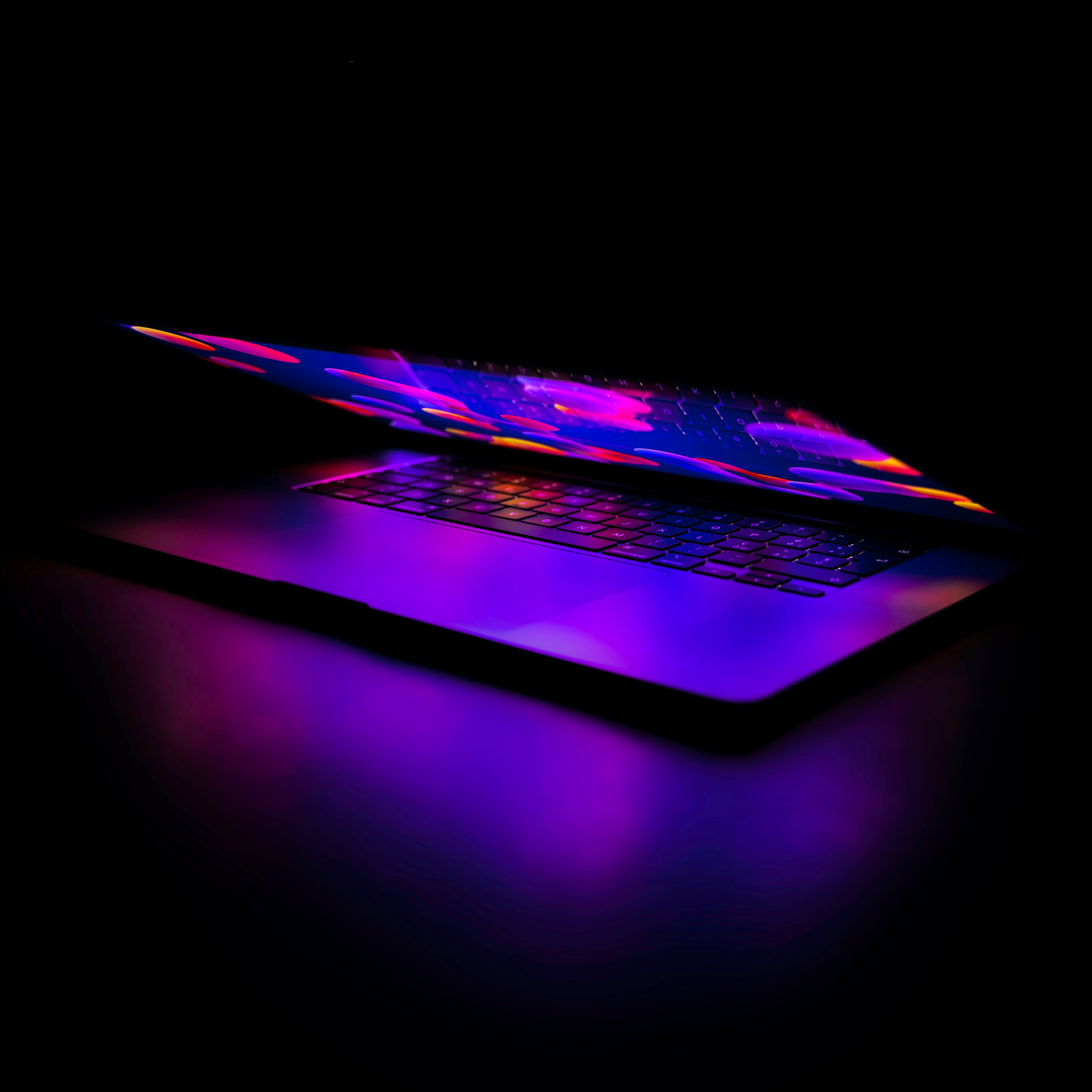a laptop computer sitting on top of a table