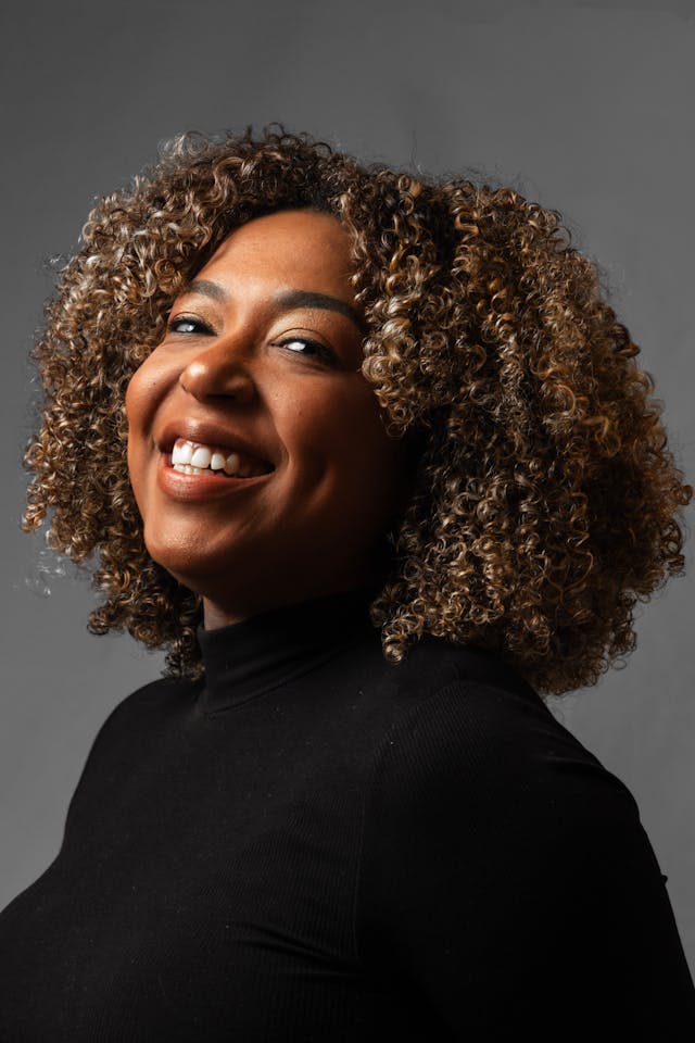 Professional Woman Smiling in Business Attire