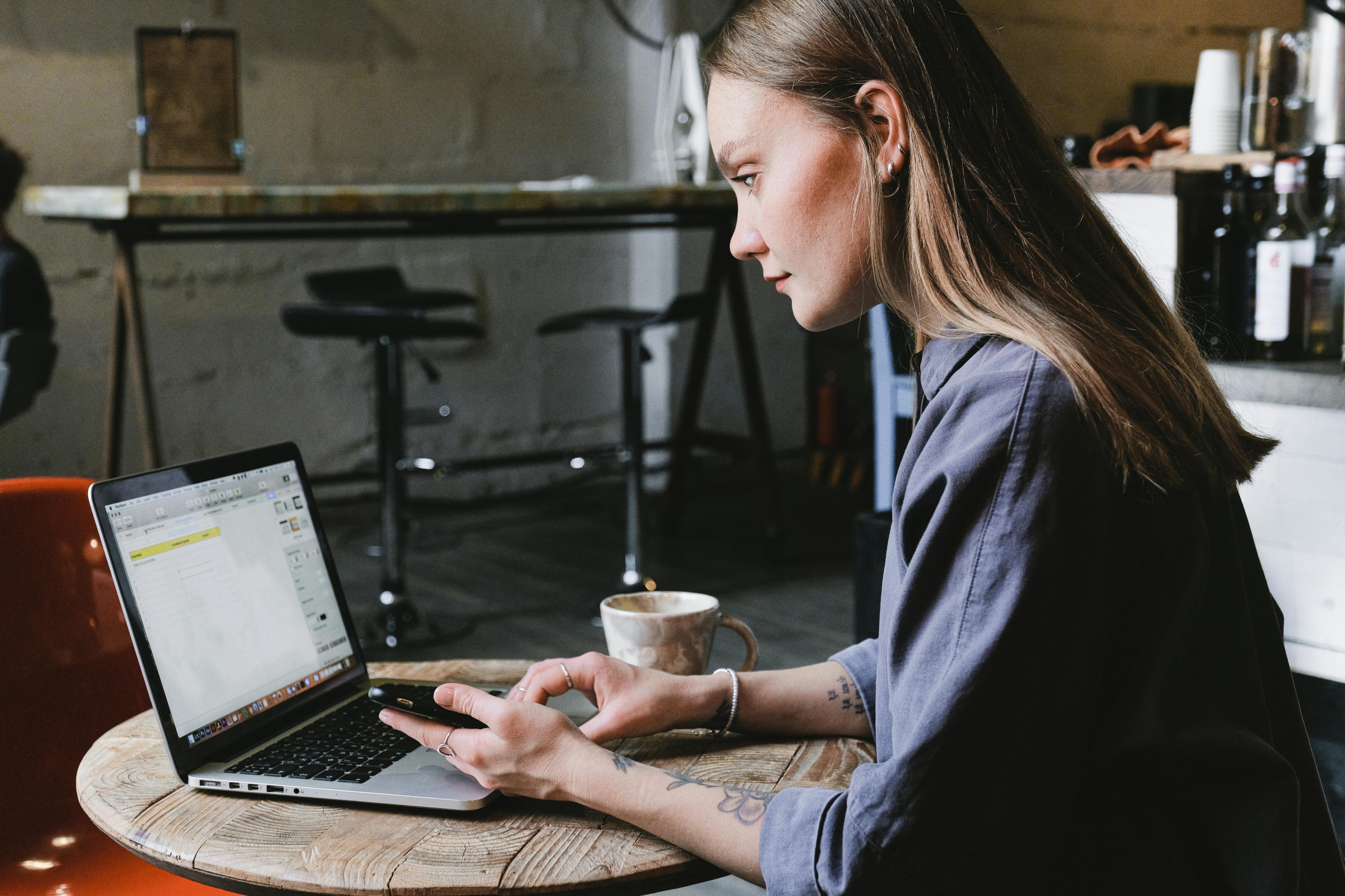 Woman surfing internet on laptop about secret to cold emails