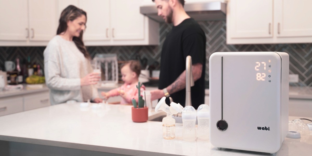 A family in the kitchen using Wabi’s UVC sanitizer and dryer, highlighting the convenience, safety, and innovation of the product.