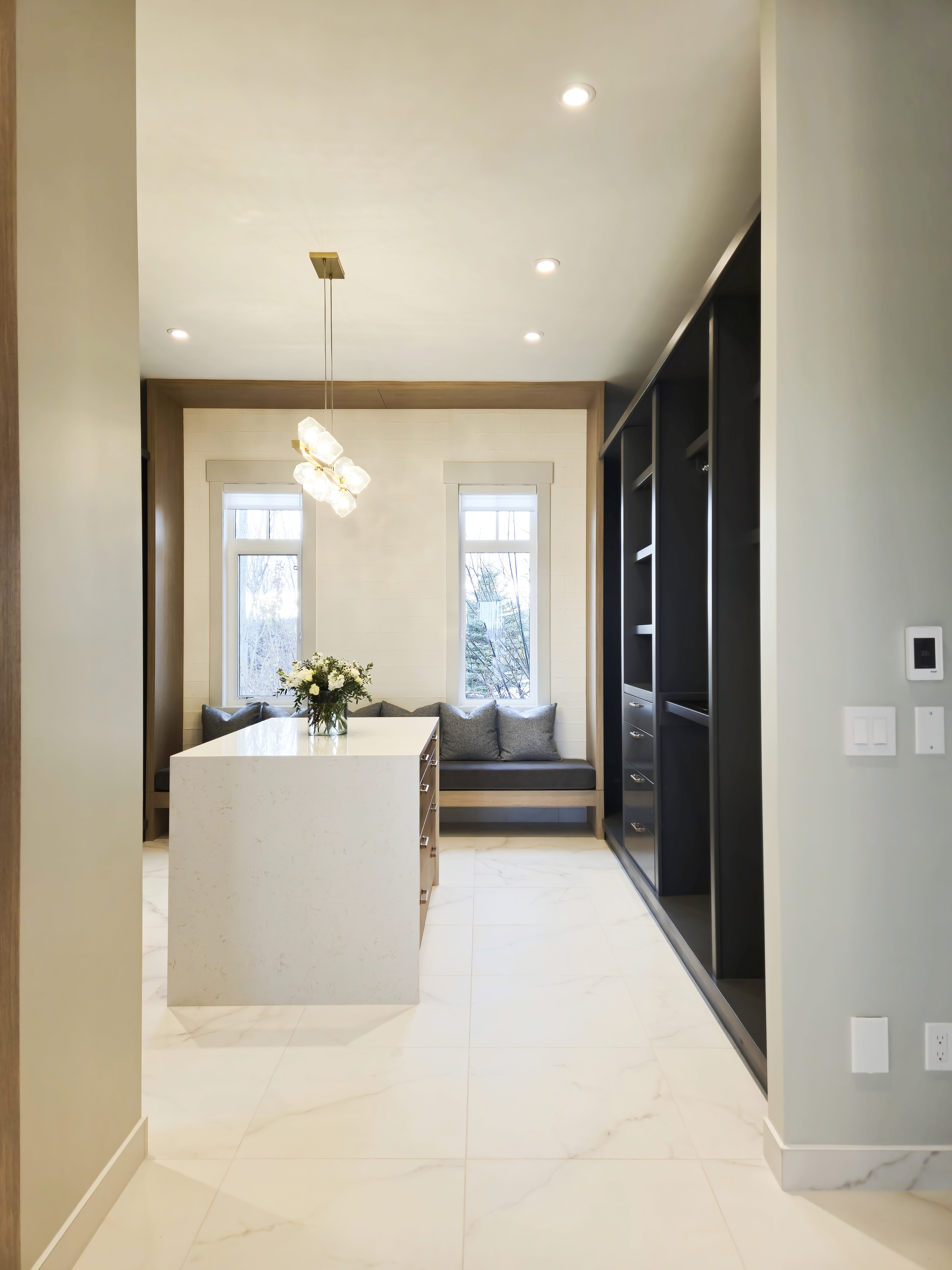 Image of walk in closet with blue perimeter millwork.
