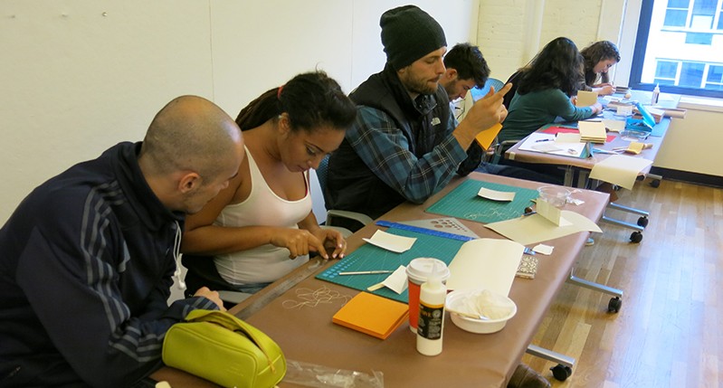 students working with materials and tools in the course class