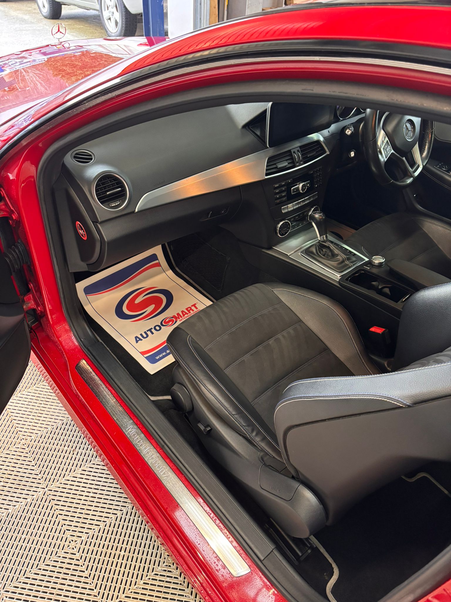a row of cars parked in a parking lot