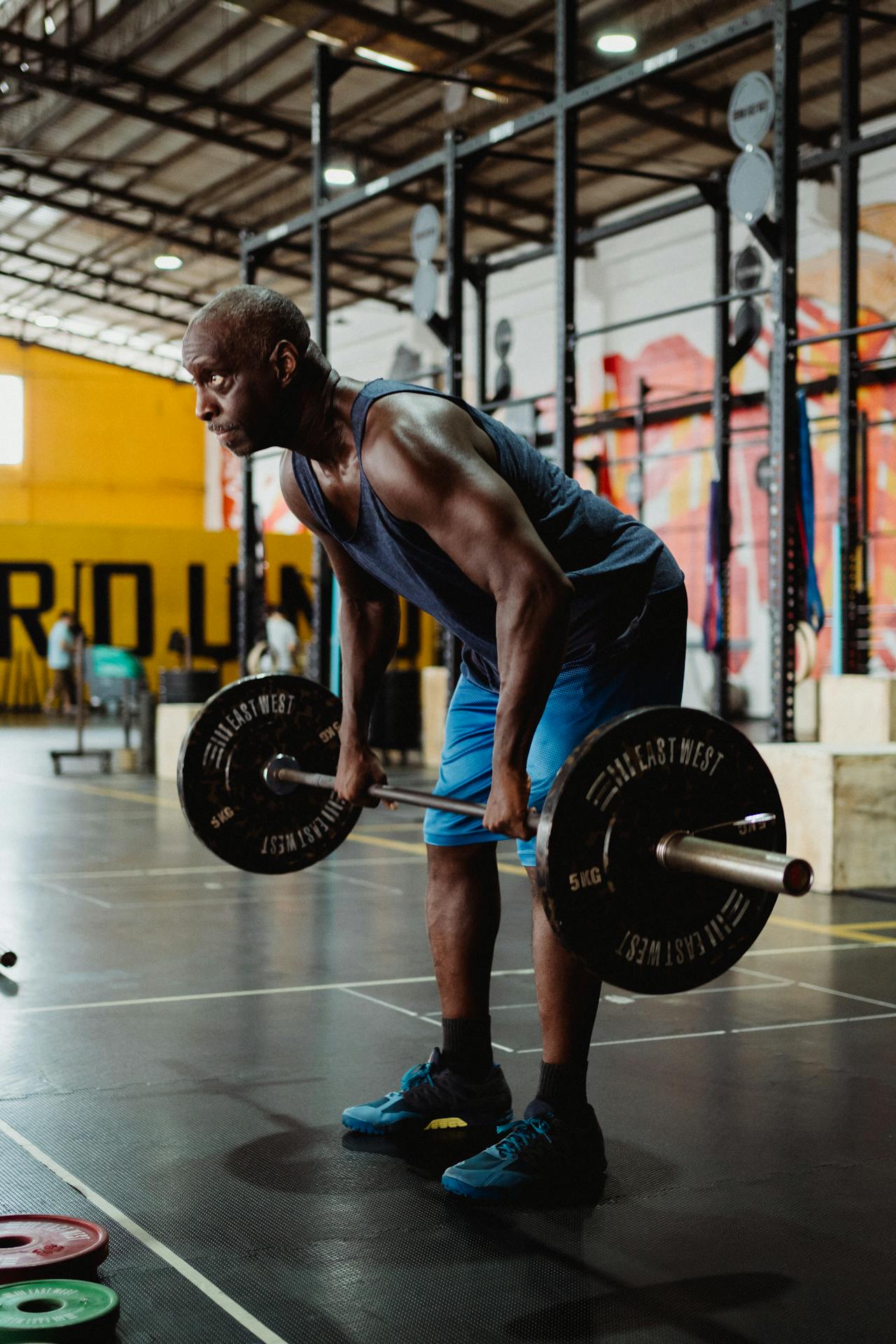 man with blue short in gym