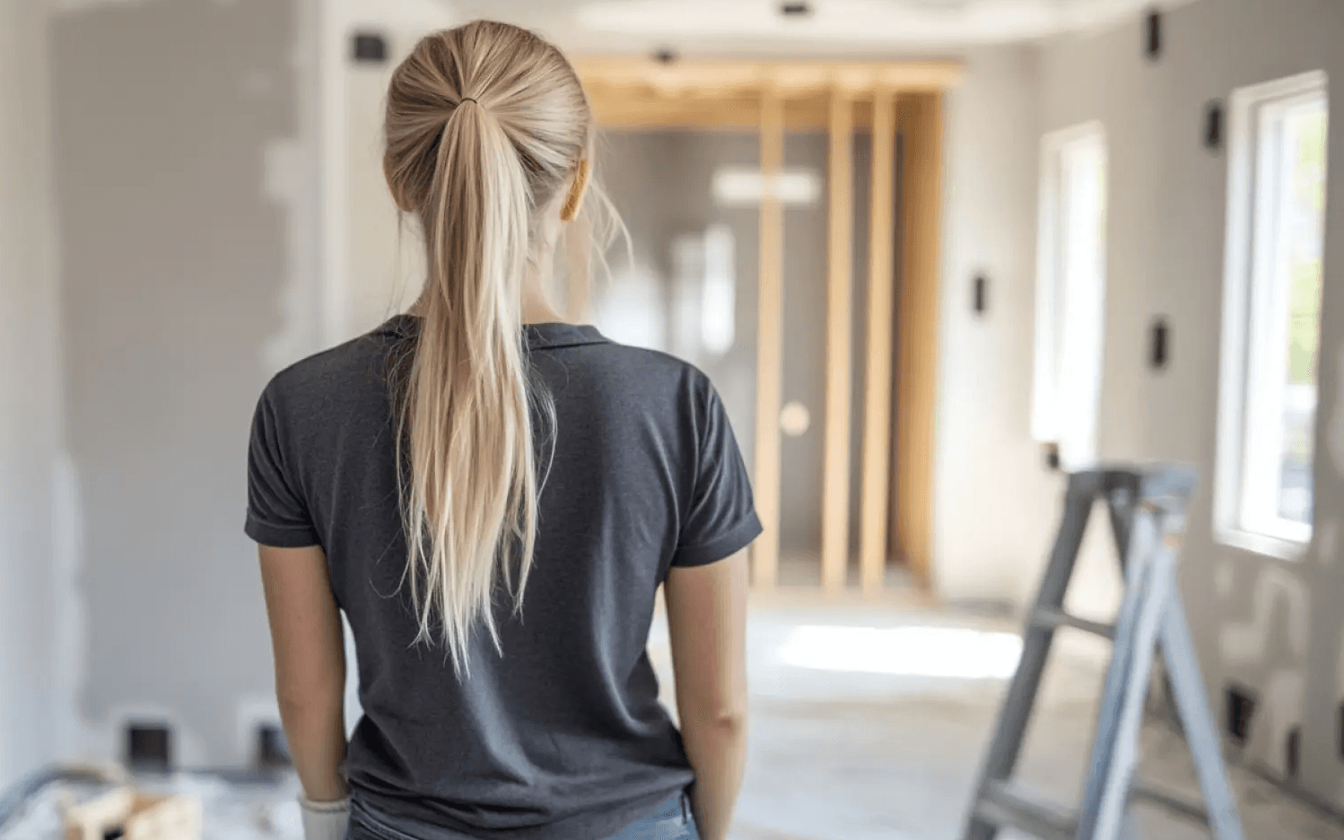 Woman standing with her back toward the camera ready to clean a residential construviot product