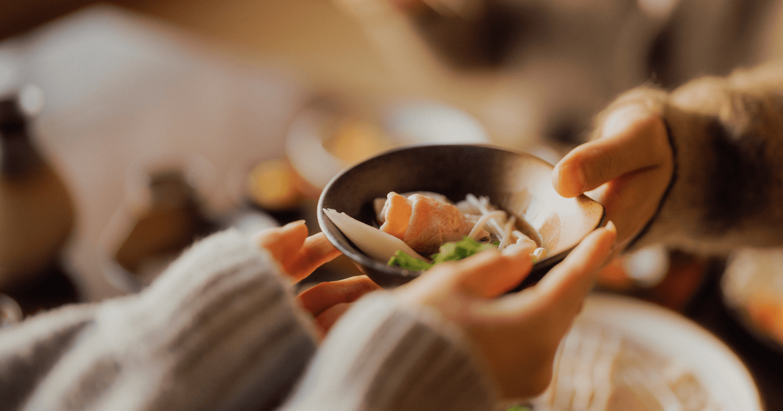 Customers sharing a bowl of food