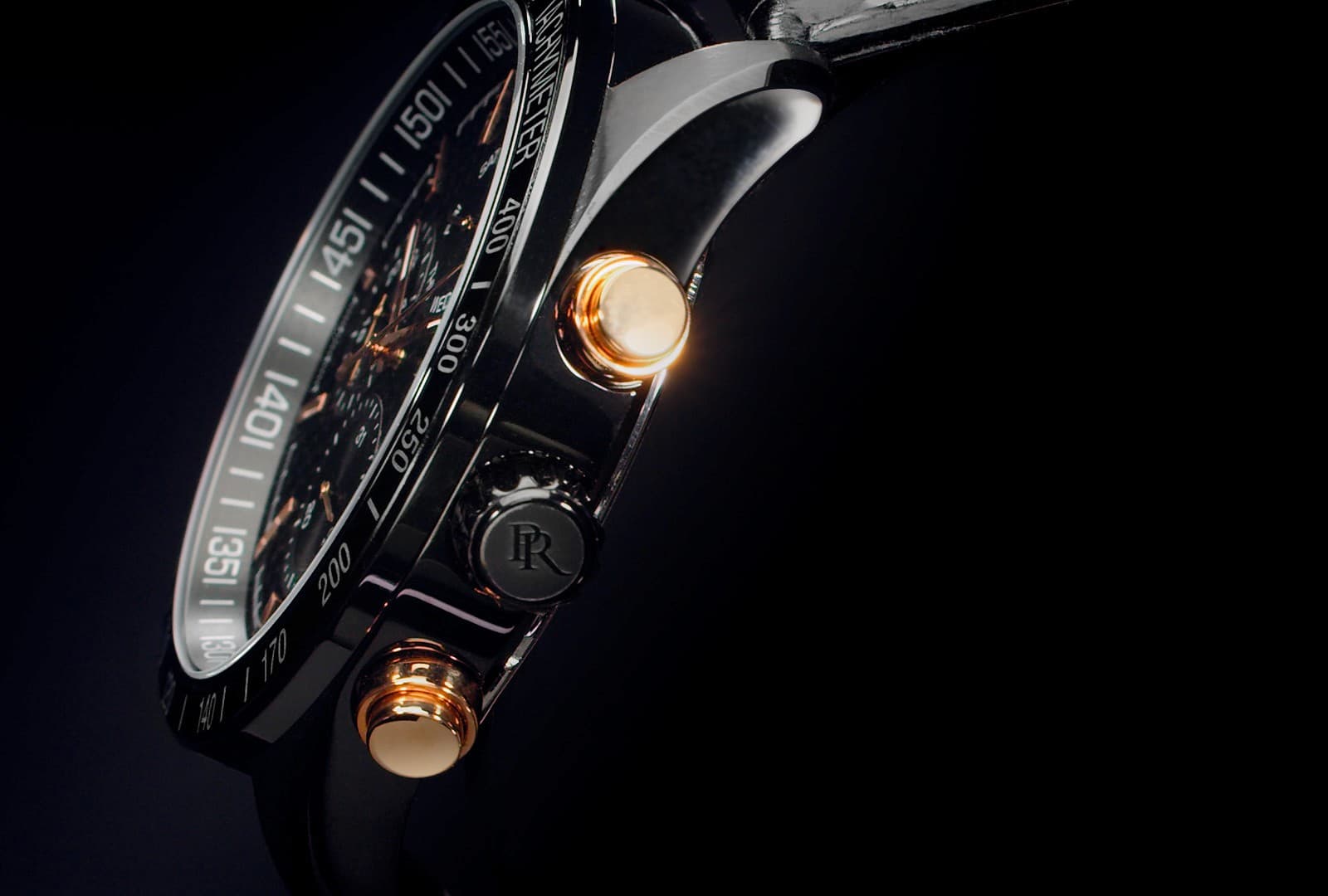 Chronograph watch close-up with illuminated pushers and dramatic cinematic lighting, high-end commercial video production still.