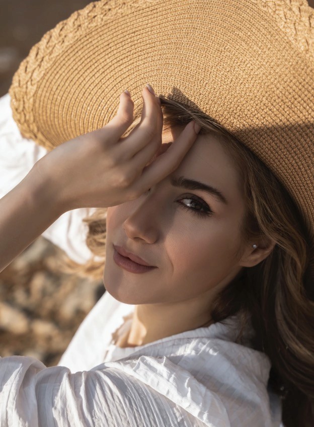 Woman in brown hat