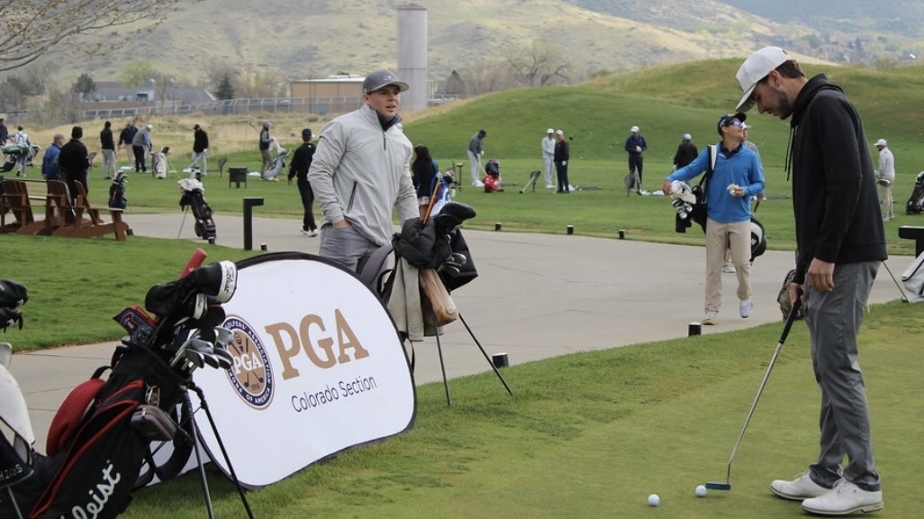 Jack and Jax at a crowded golf event.