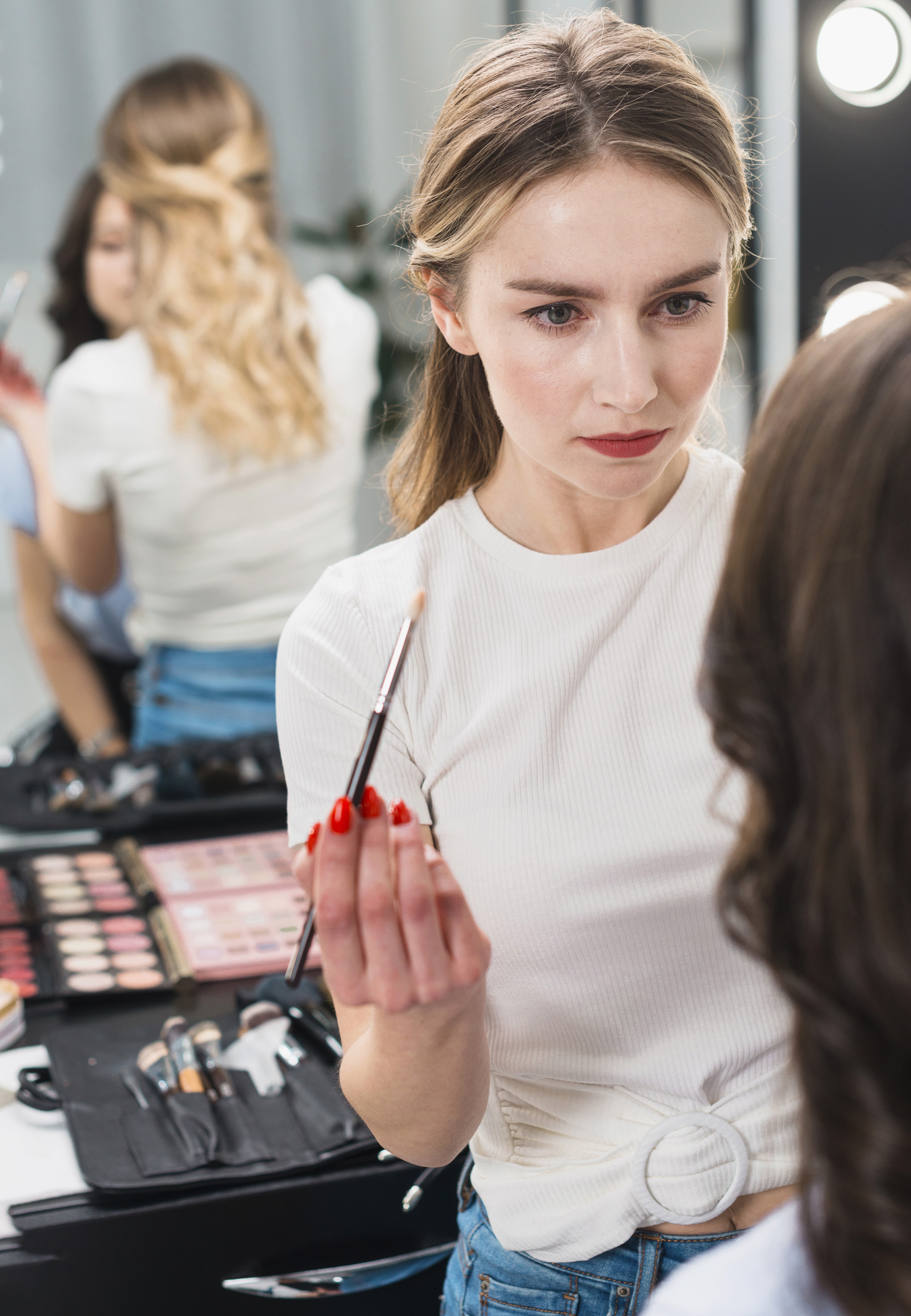 a-makeup-artist-skillfully-applies-cosmetics-to-a-woman-in-a-beauty-studio. - hong-son (pexels)