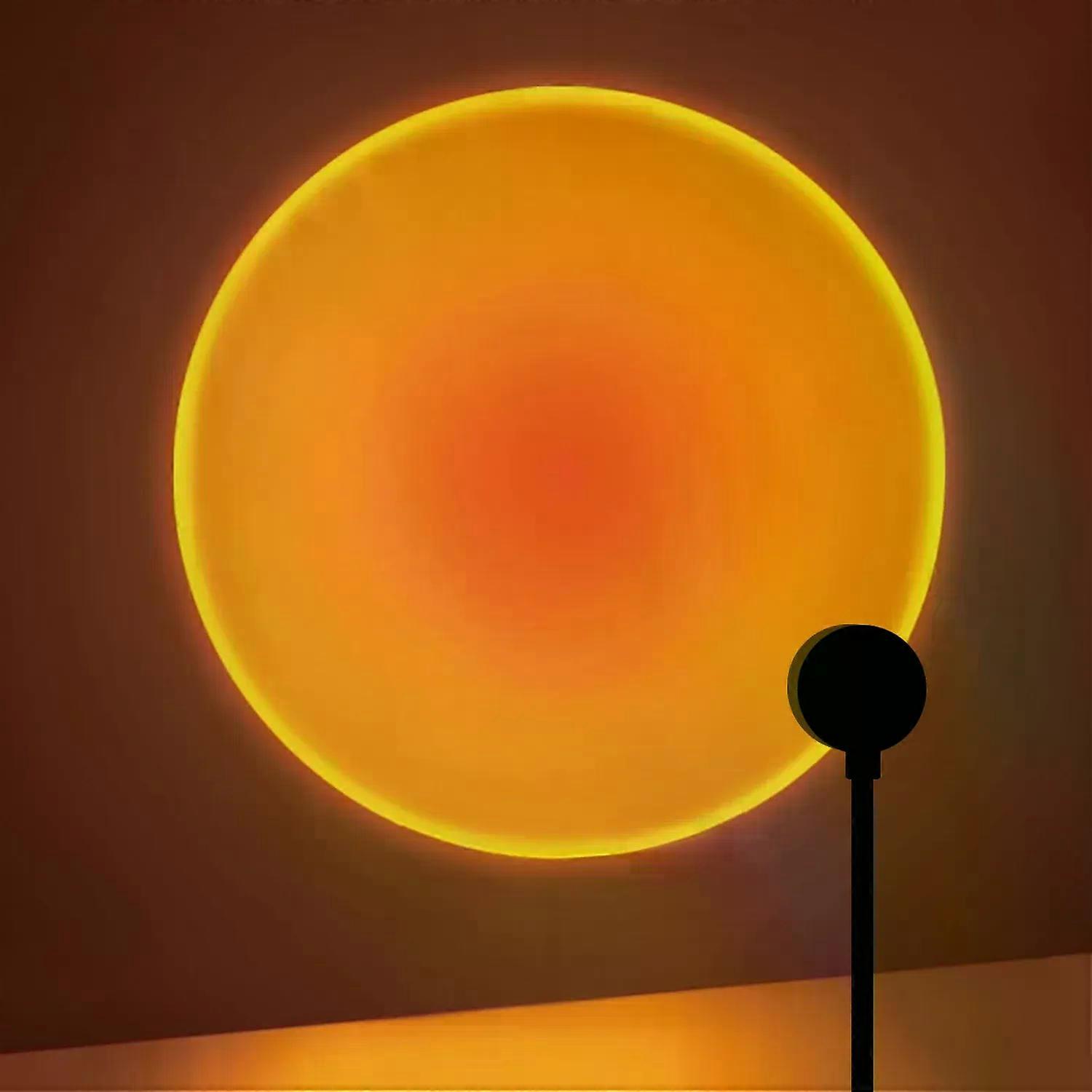 Minimal circular ambient light projecting warm gradient on wall