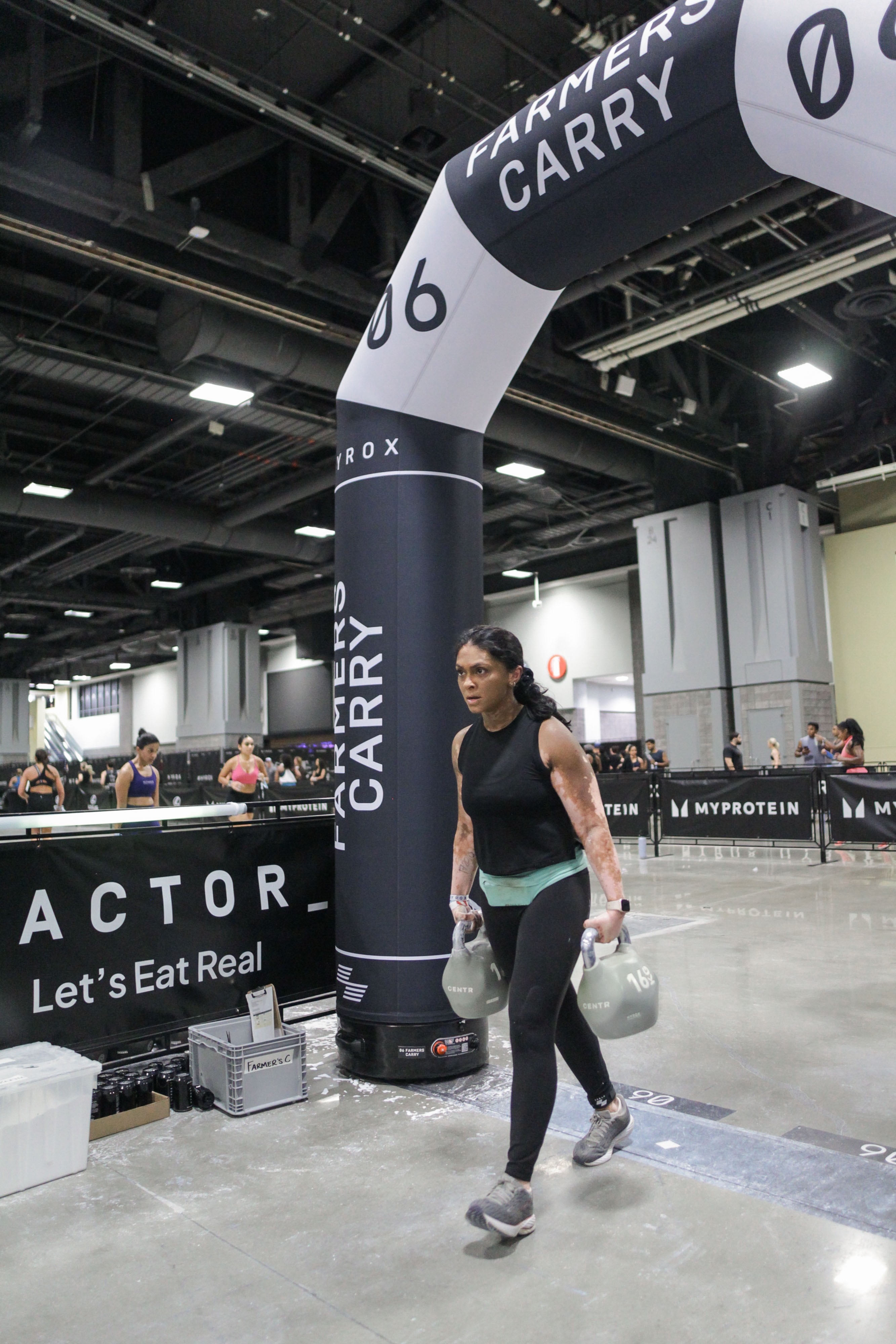 Sanji carrying kettlebells during the HYROX race in D.C.