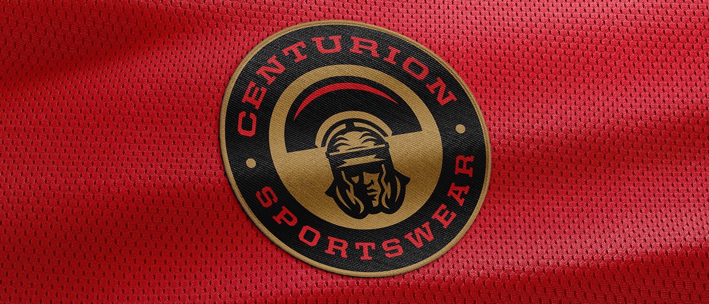 Centurion Sportswear badge logo mocked up on red jersey mesh.