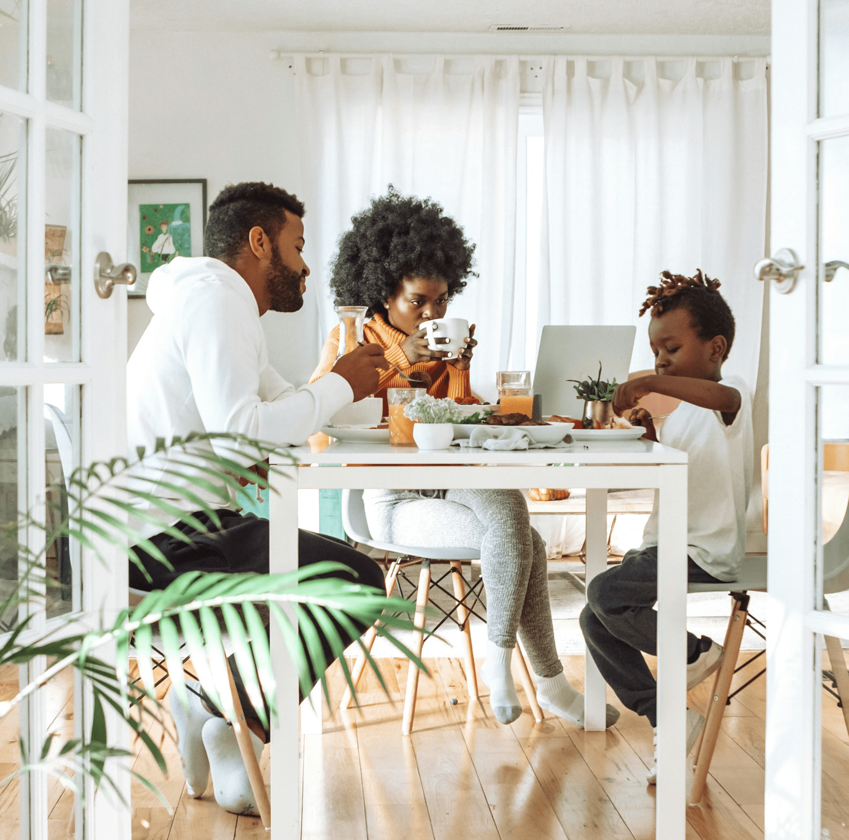 Couple reviewing documents together on laptop at home