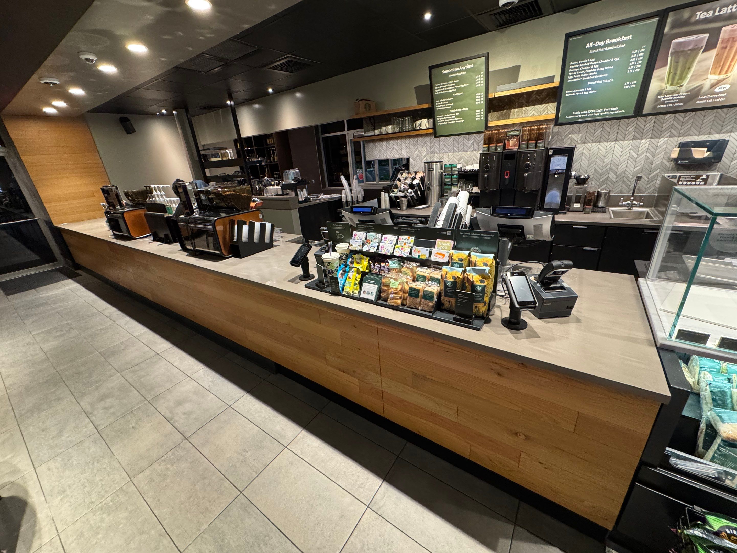 Completed Starbucks front counter replacement featuring durable, water-resistant surface and seamless finish around beverage station and point-of-sale area.