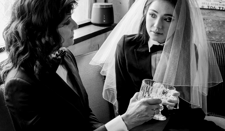 A female couple wearing chic androgynous suits in australia