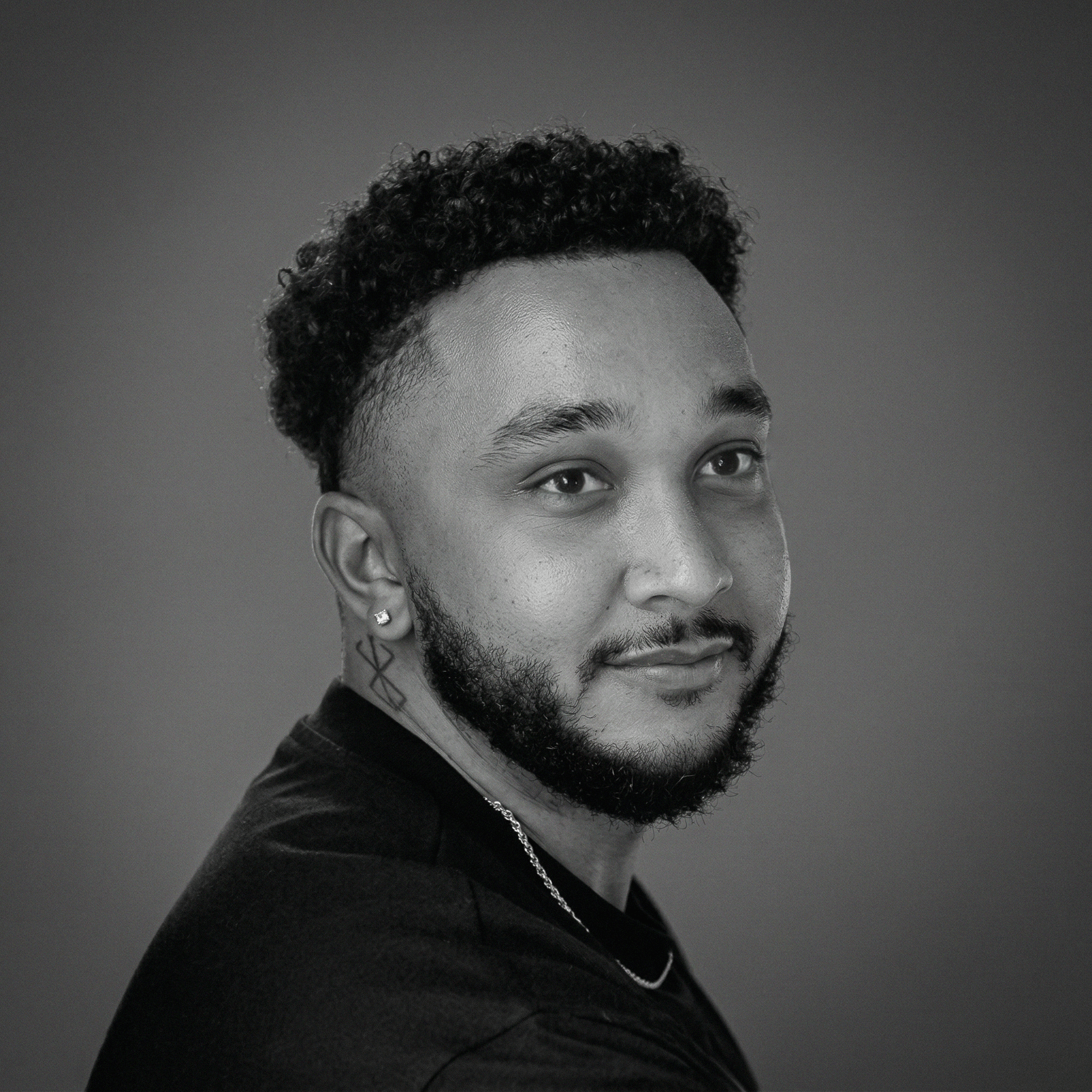 a blurry photo of a person standing in front of a wall