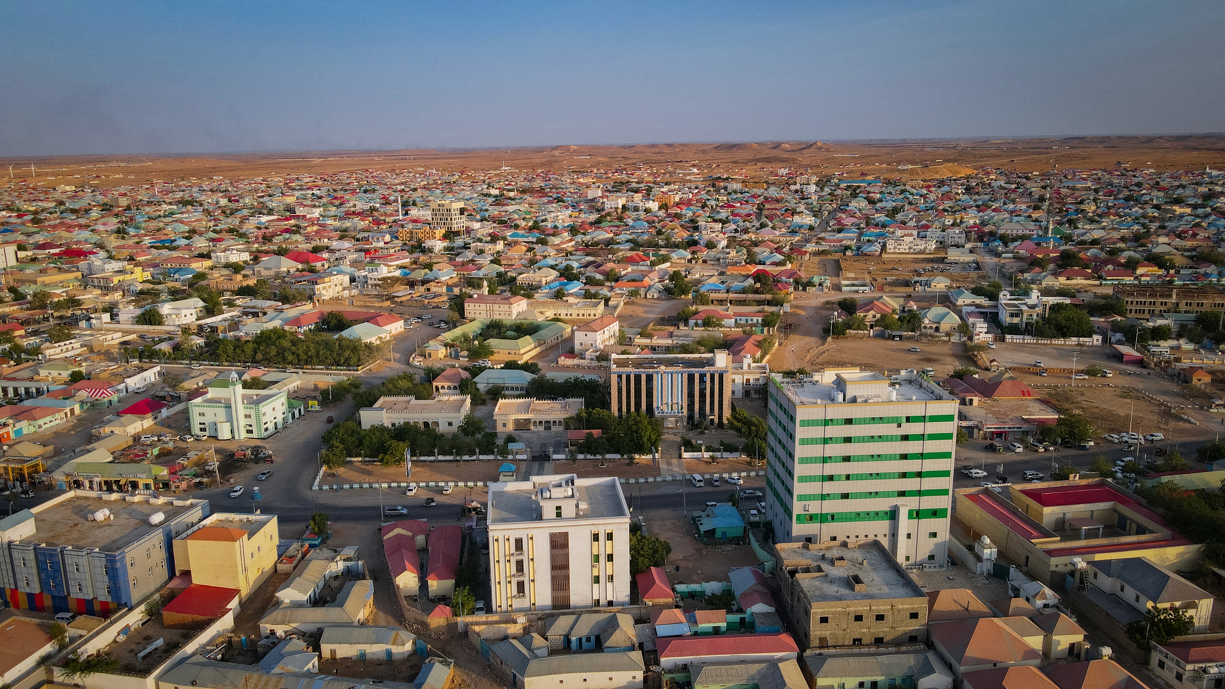 A man and a woman looking at a laptop