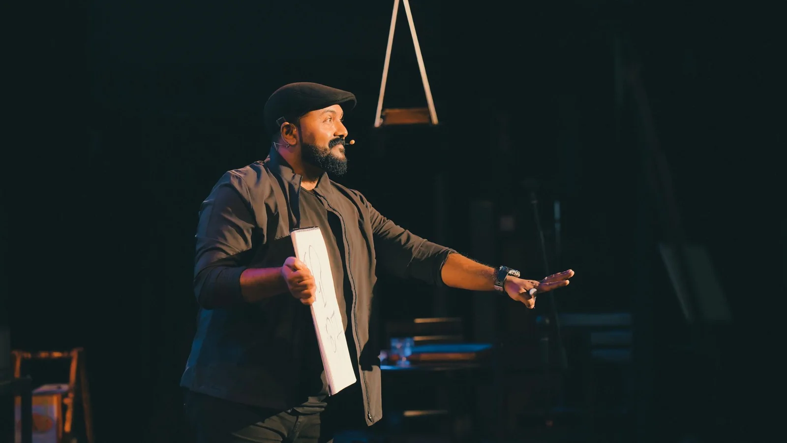 Tom Wisniewski speaking on stage at Confluence Church