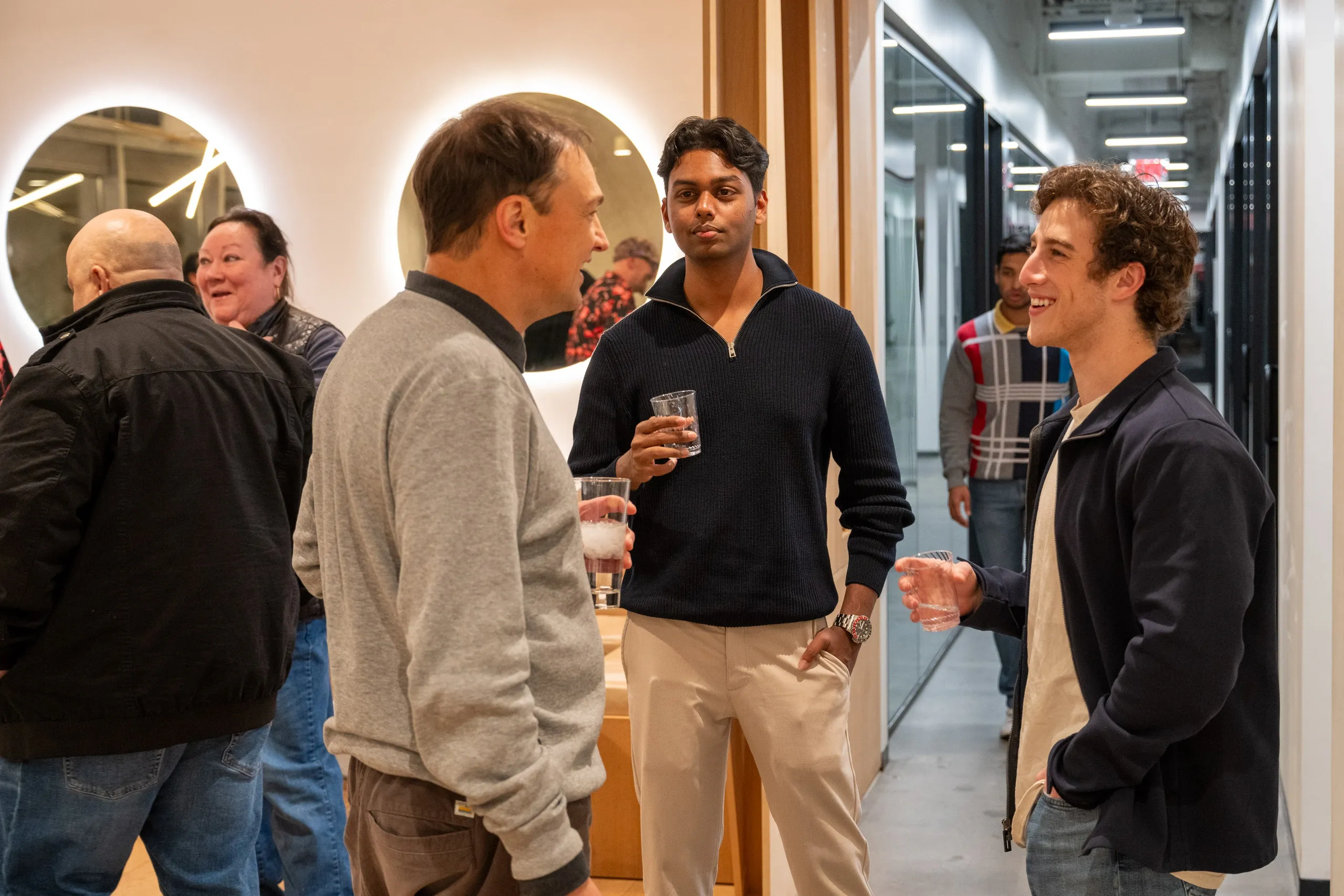 a group of children sitting on steps in front of a building