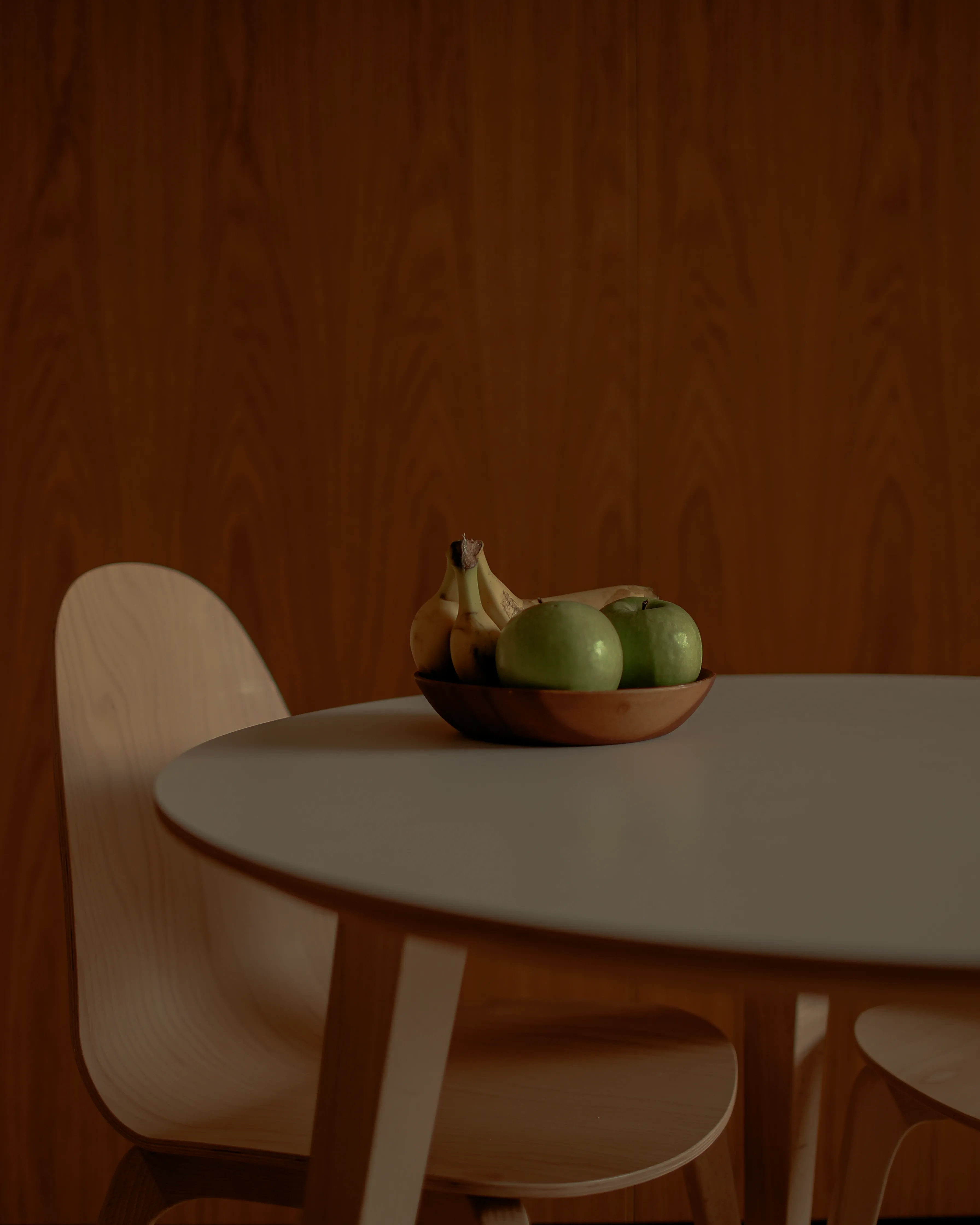 A scene of an oakwood fruit bowl on the table