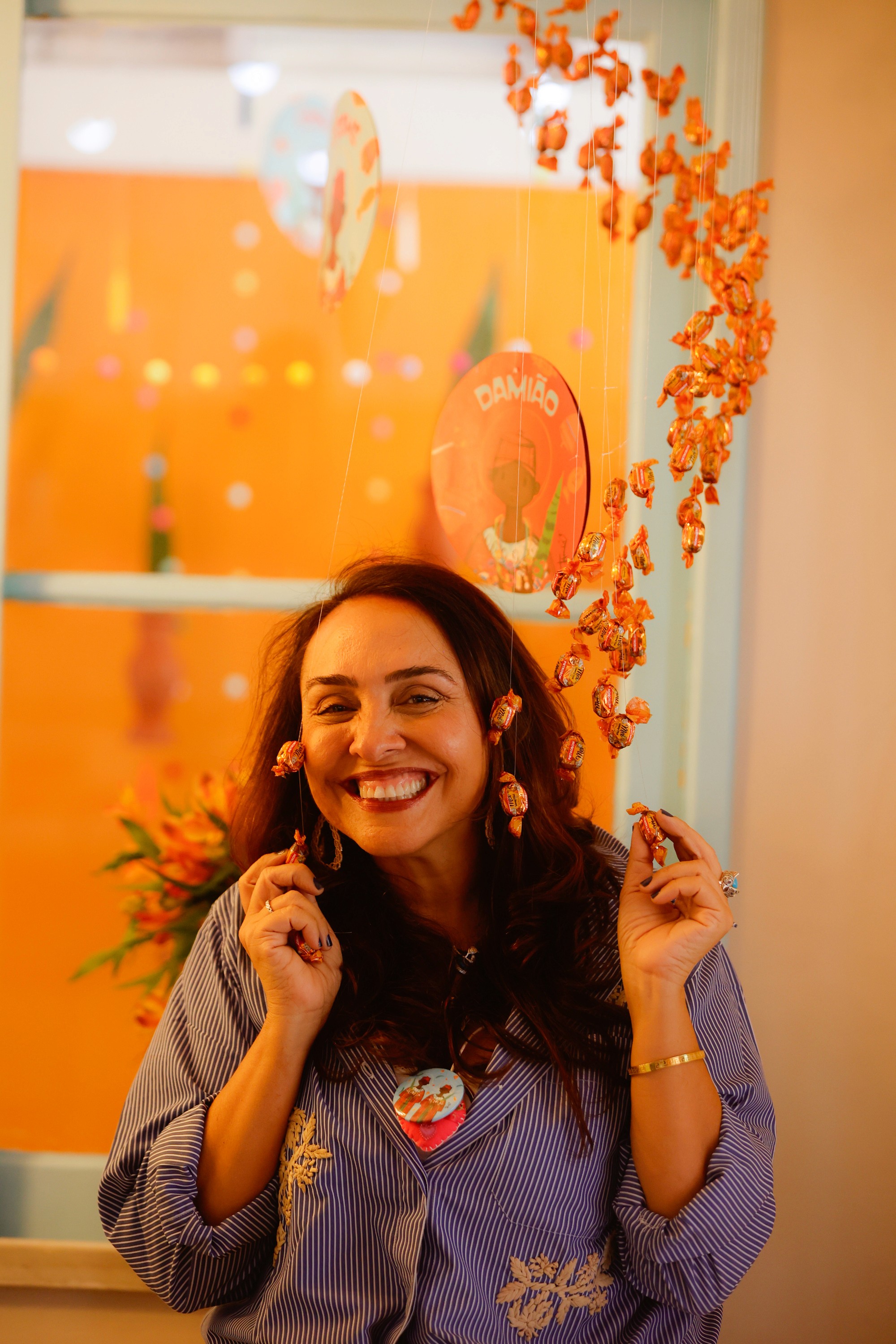 A small white boat rests on a pebble beach.