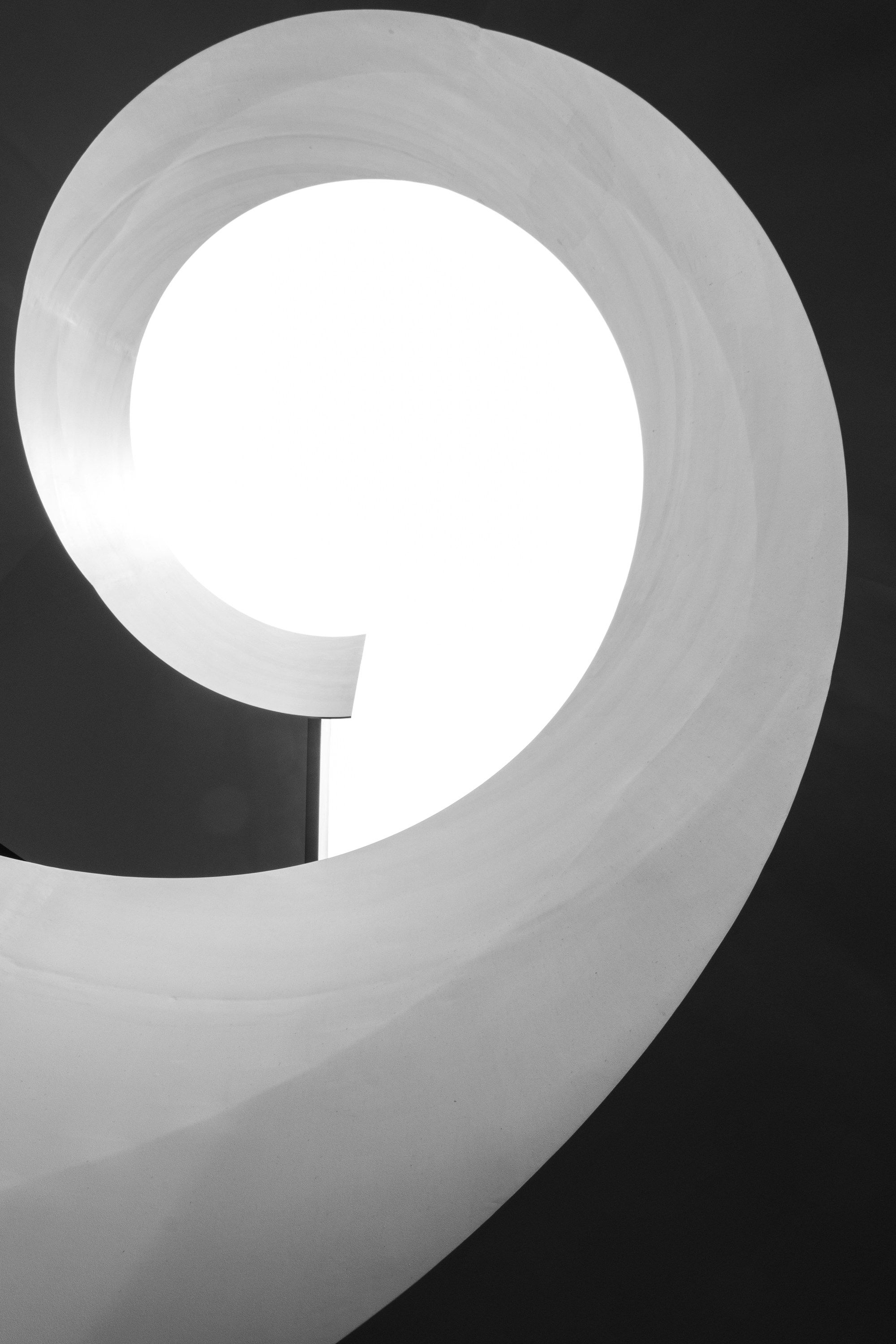 Curved white form in soft light