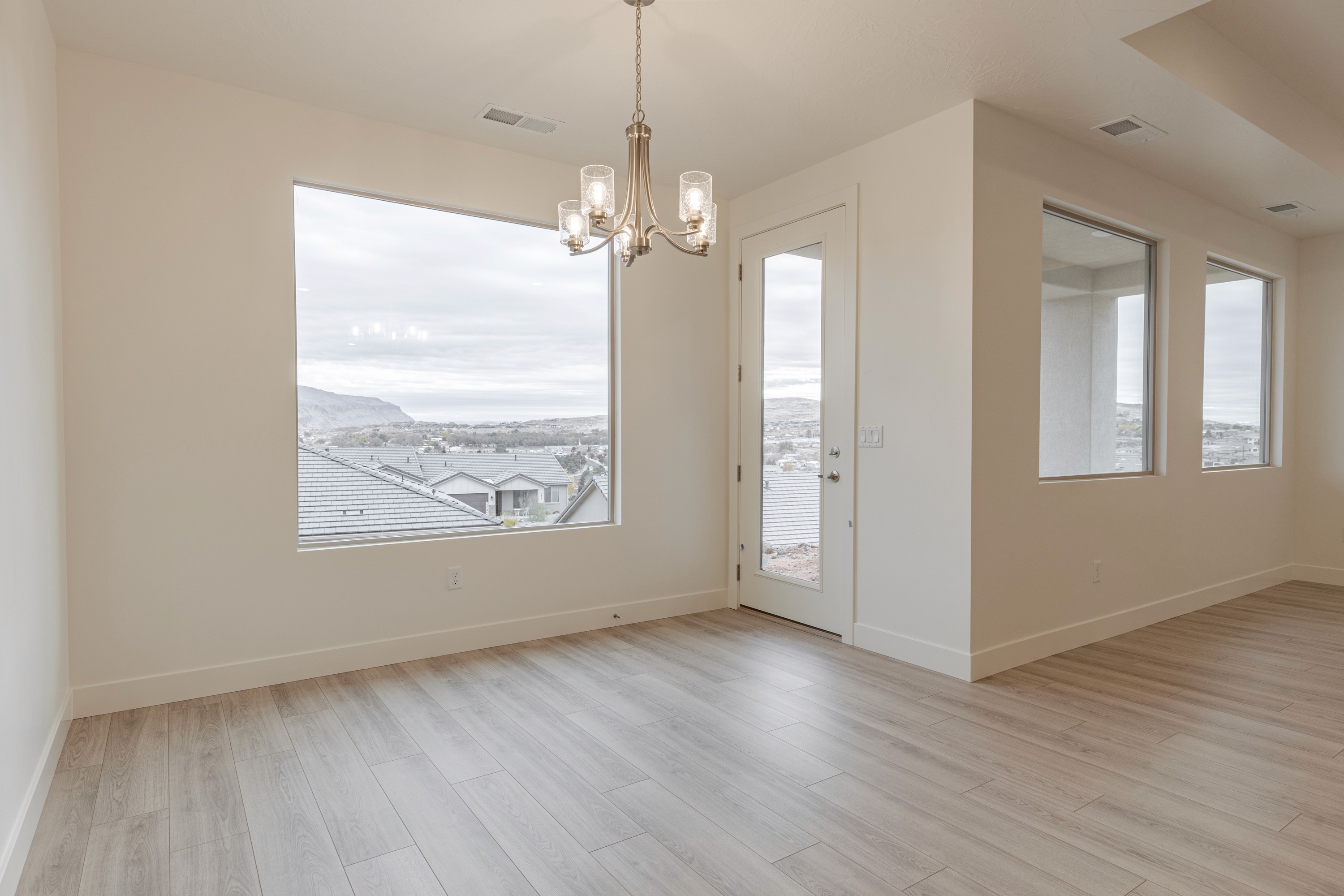 Dining room in the Painted Sands twin home in Hurricane, Utah with bright, open layout and connection to living spaces.