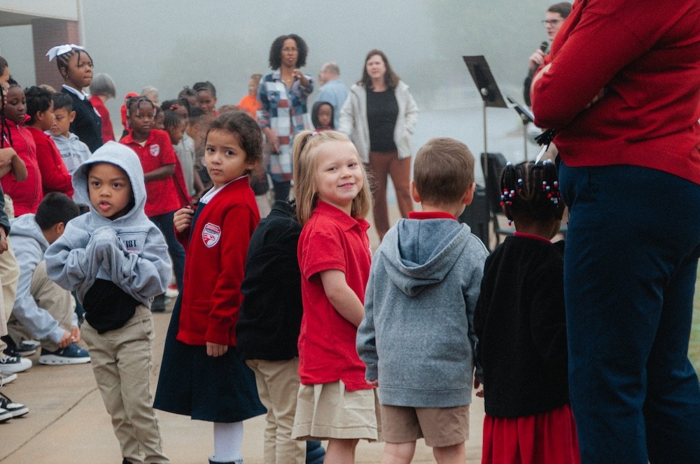 A group of K4 students outside for our Veterans Day ceremony