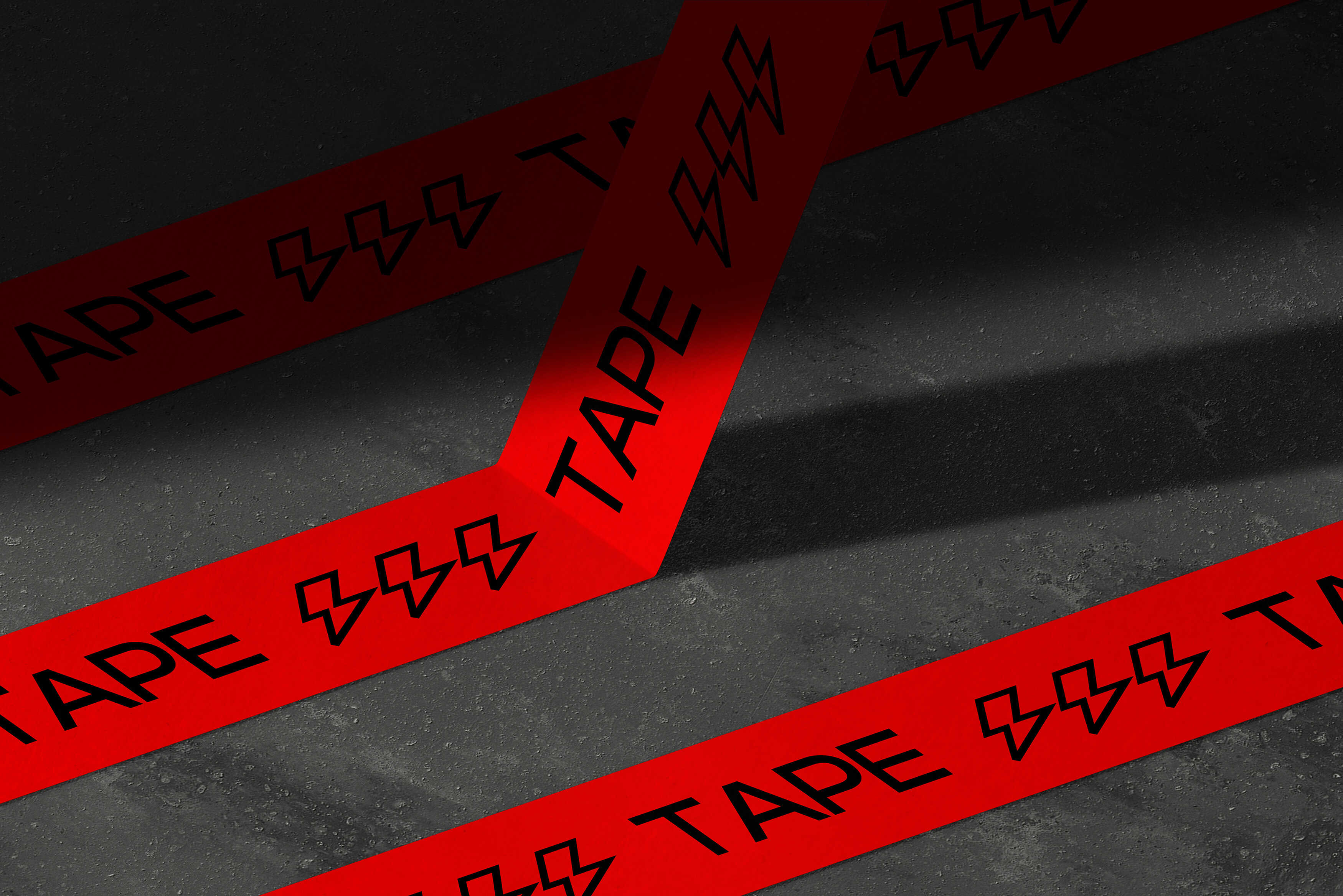 Red printed tape with black typography arranged diagonally across concrete steps