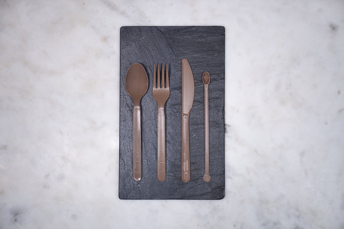 The Palmade cutlery set laid on slate