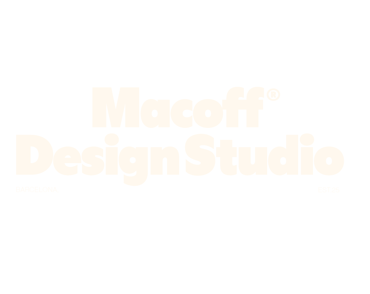 A close-up of a hand wearing multiple decorative rings against a blue background.