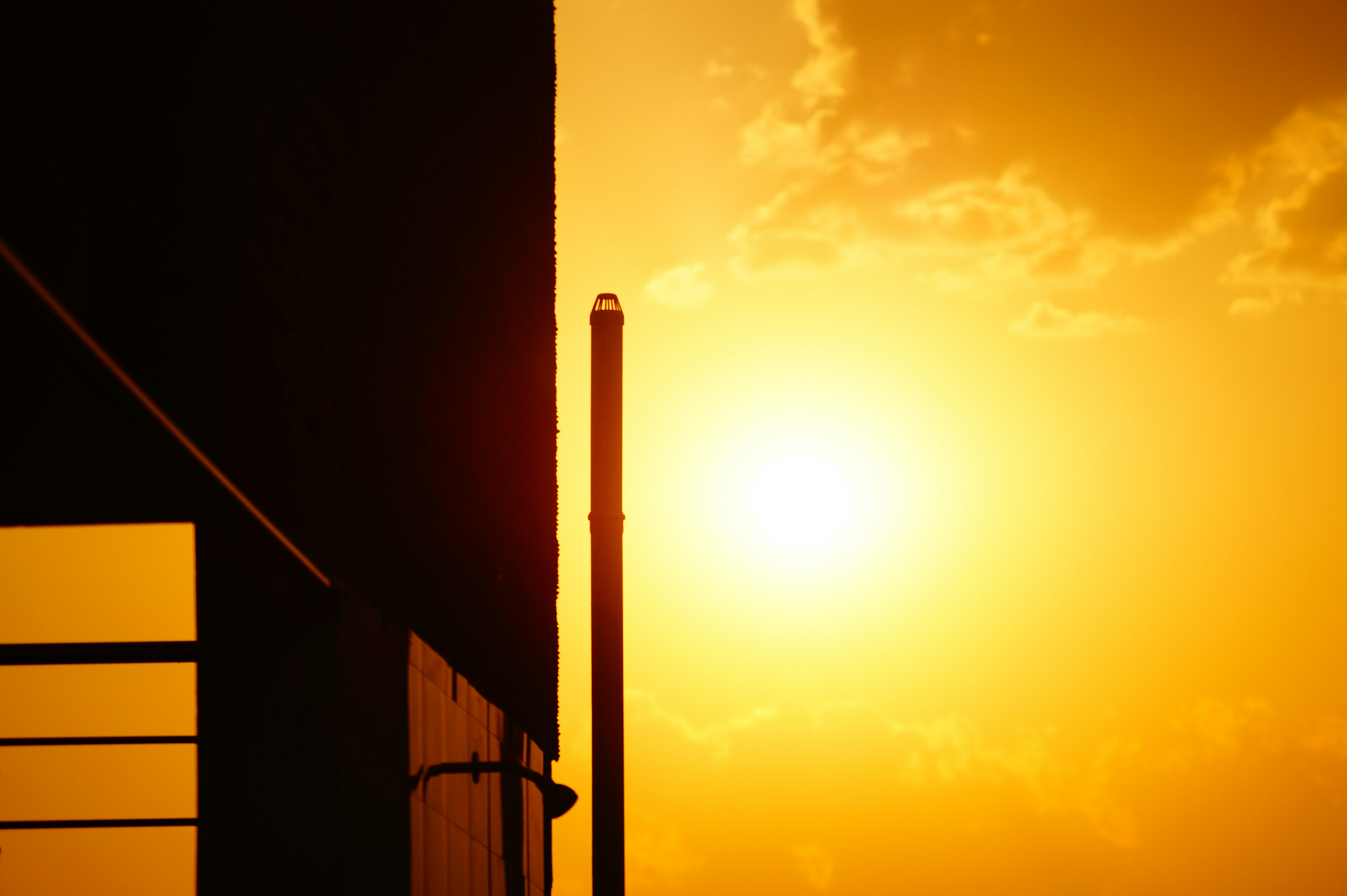 silhouette of post during sunset