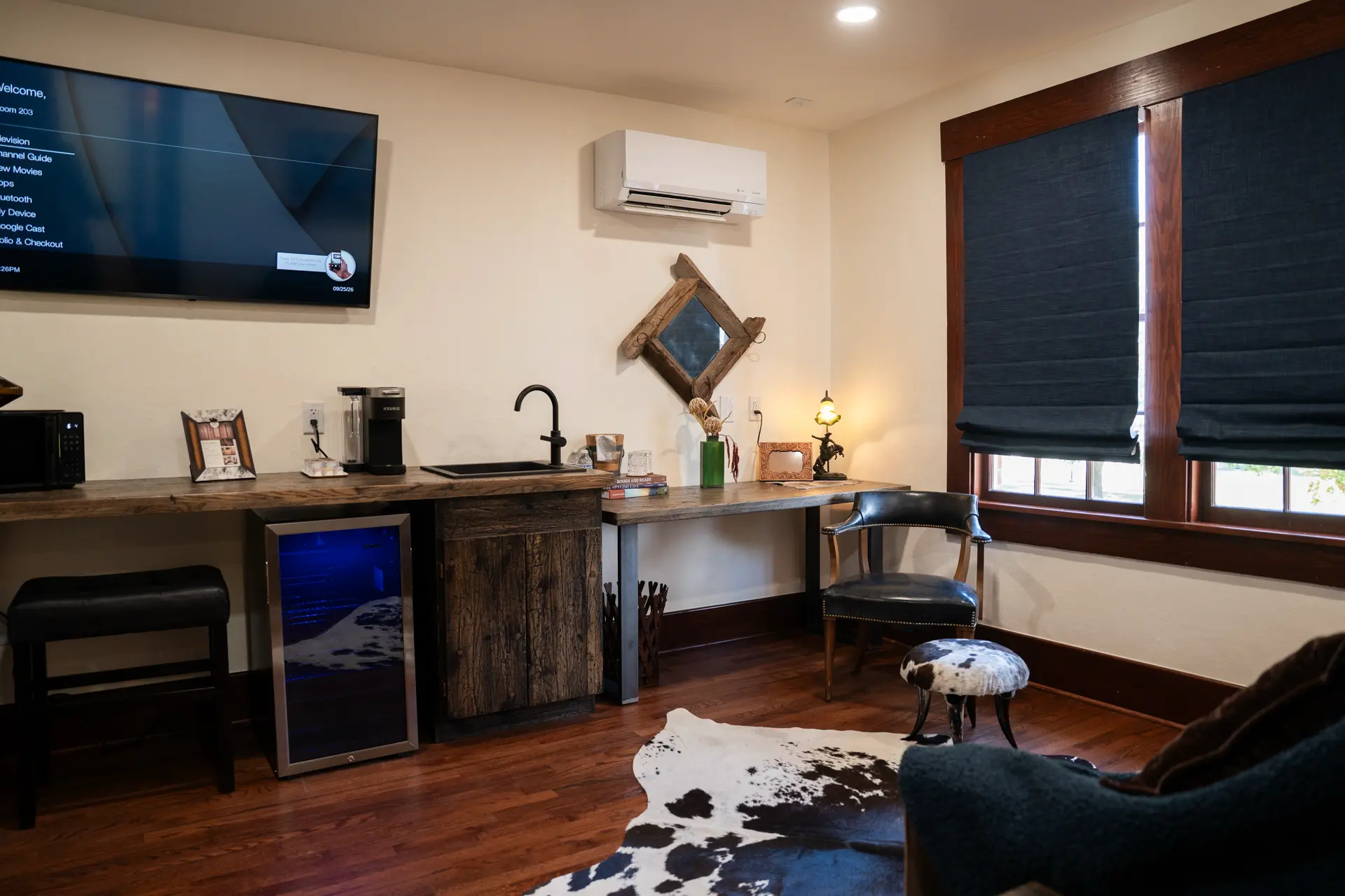 Separate living space with pull out sofa and cowhide rug