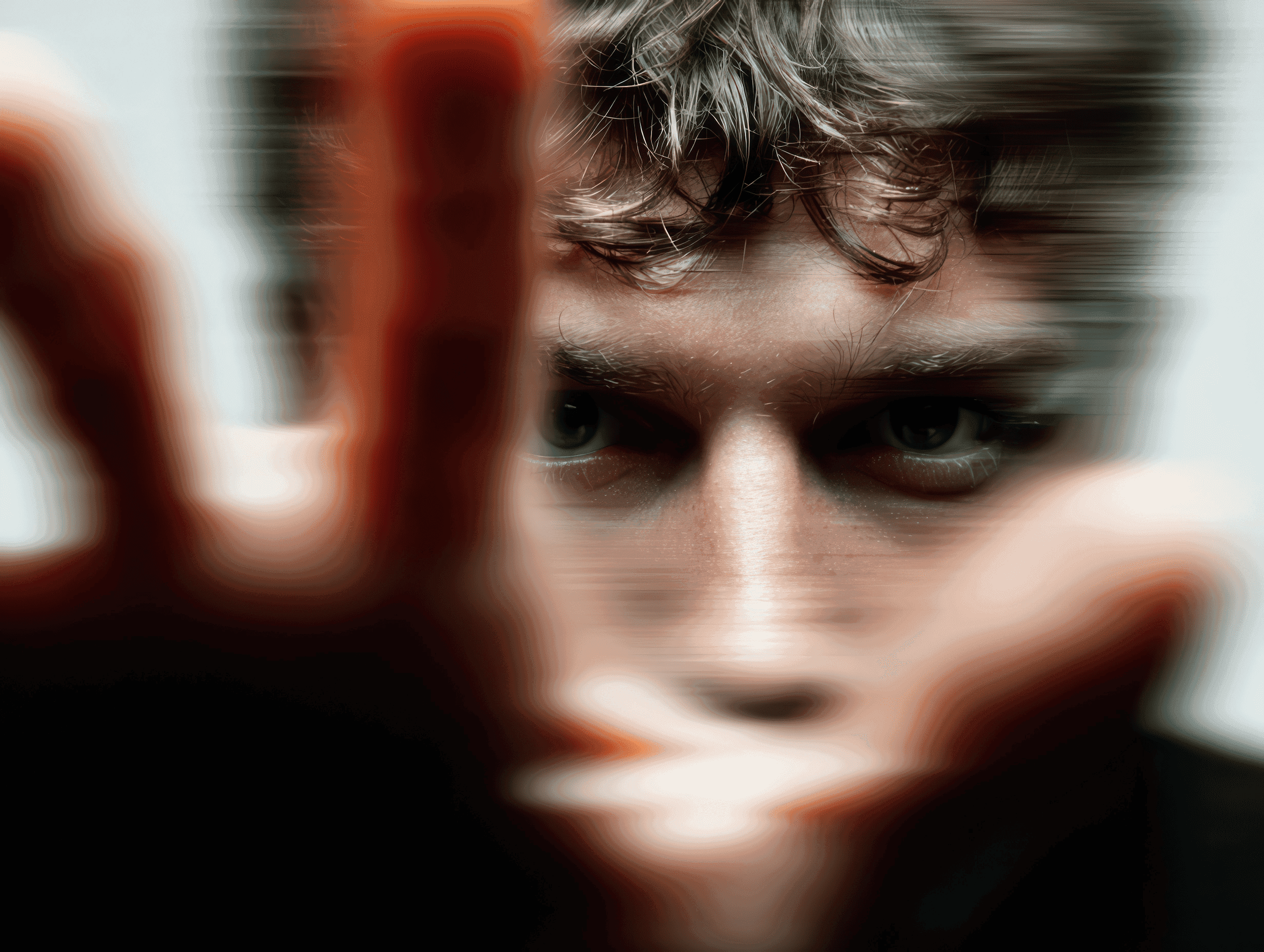 Male portrait in black cap with intense blurred background