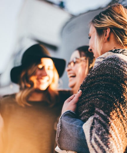 Three women laughing