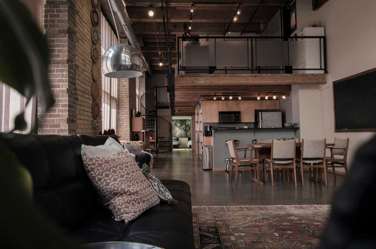 A spacious loft apartment with a modern kitchen and dining area