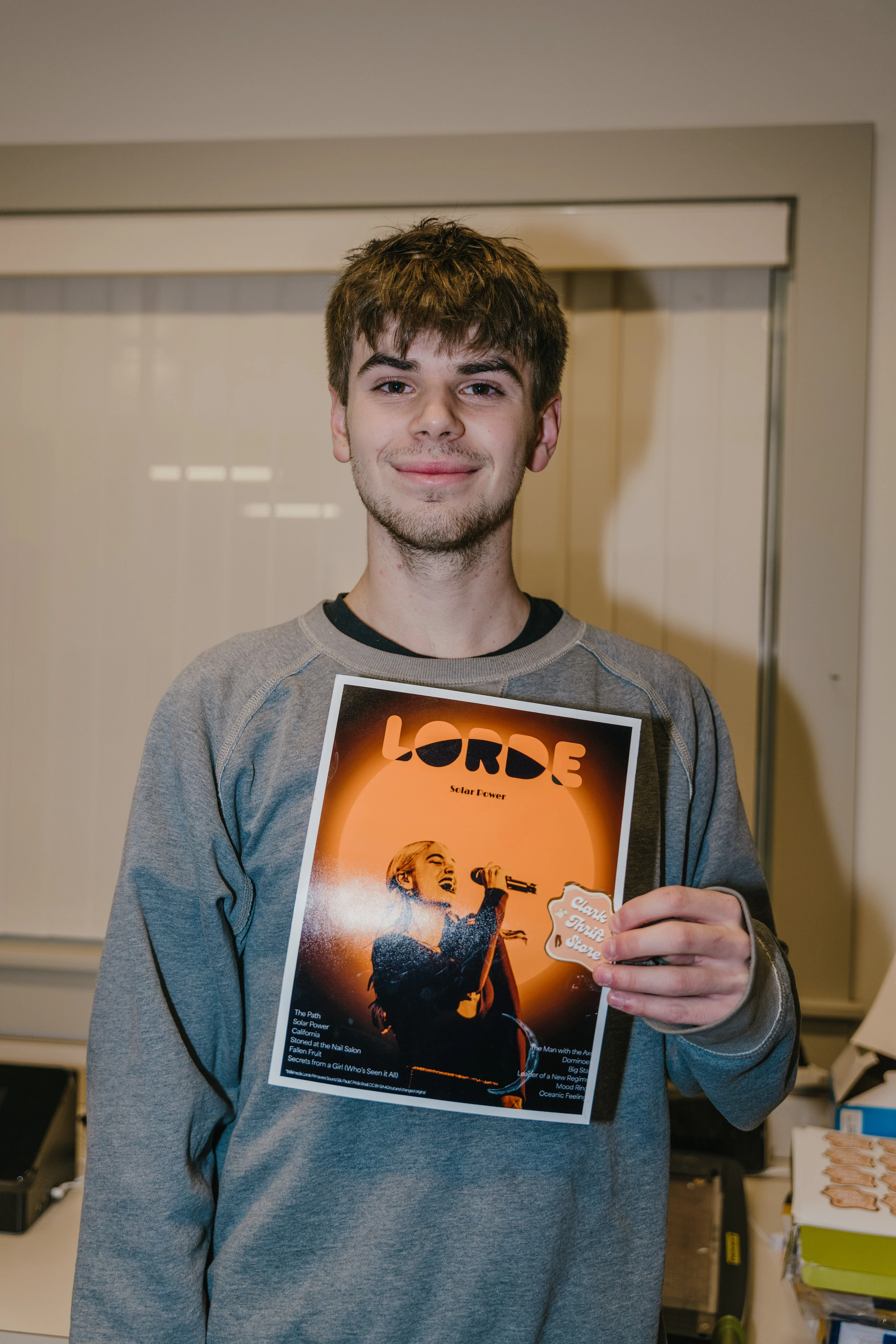 Image of Erik holding one of his posters