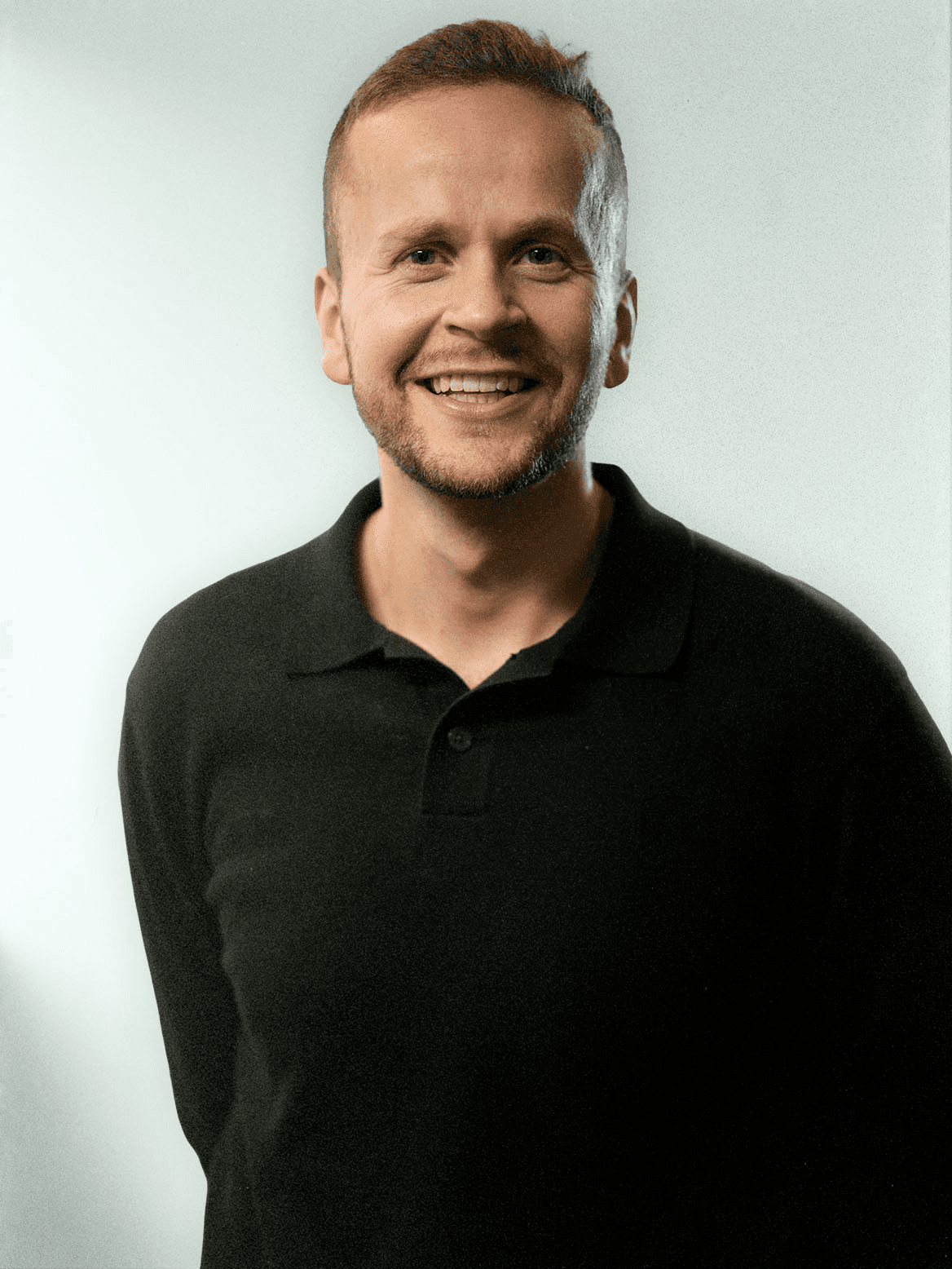 man standing beside wall