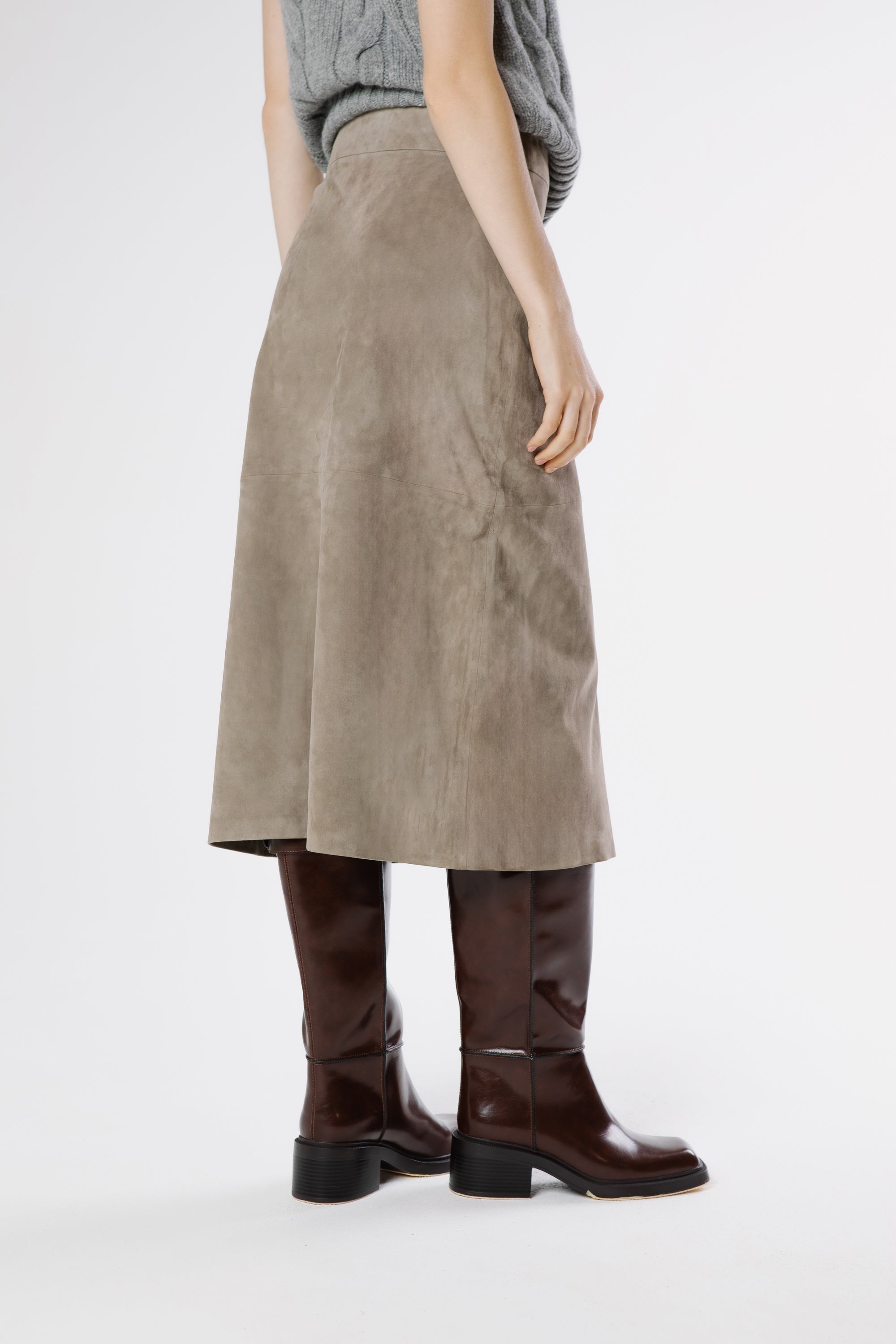 Back view of Zara suede midi skirt in drizzle grey showing clean structure and smooth panel construction.