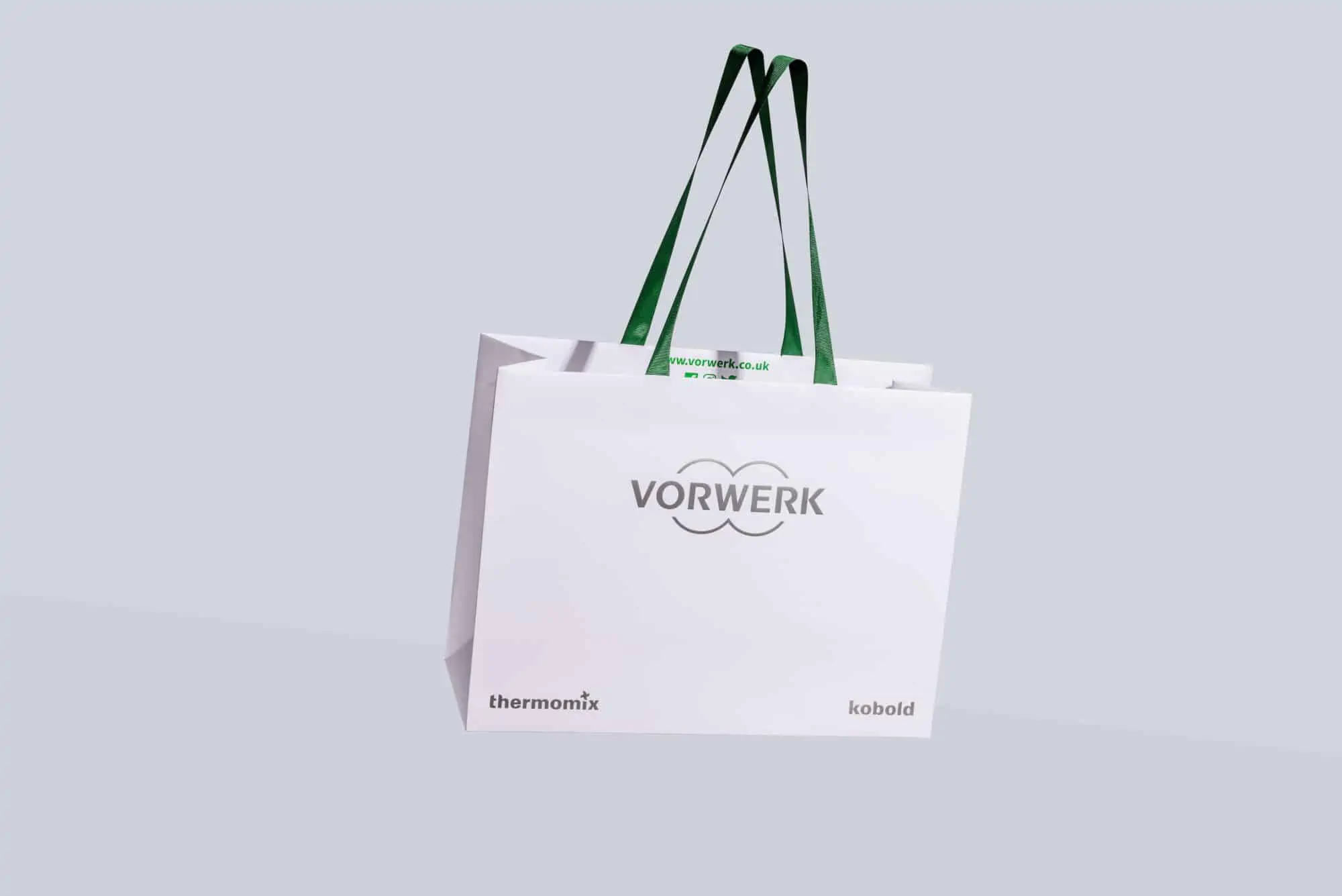 Branded carrier bag with ribbon handle