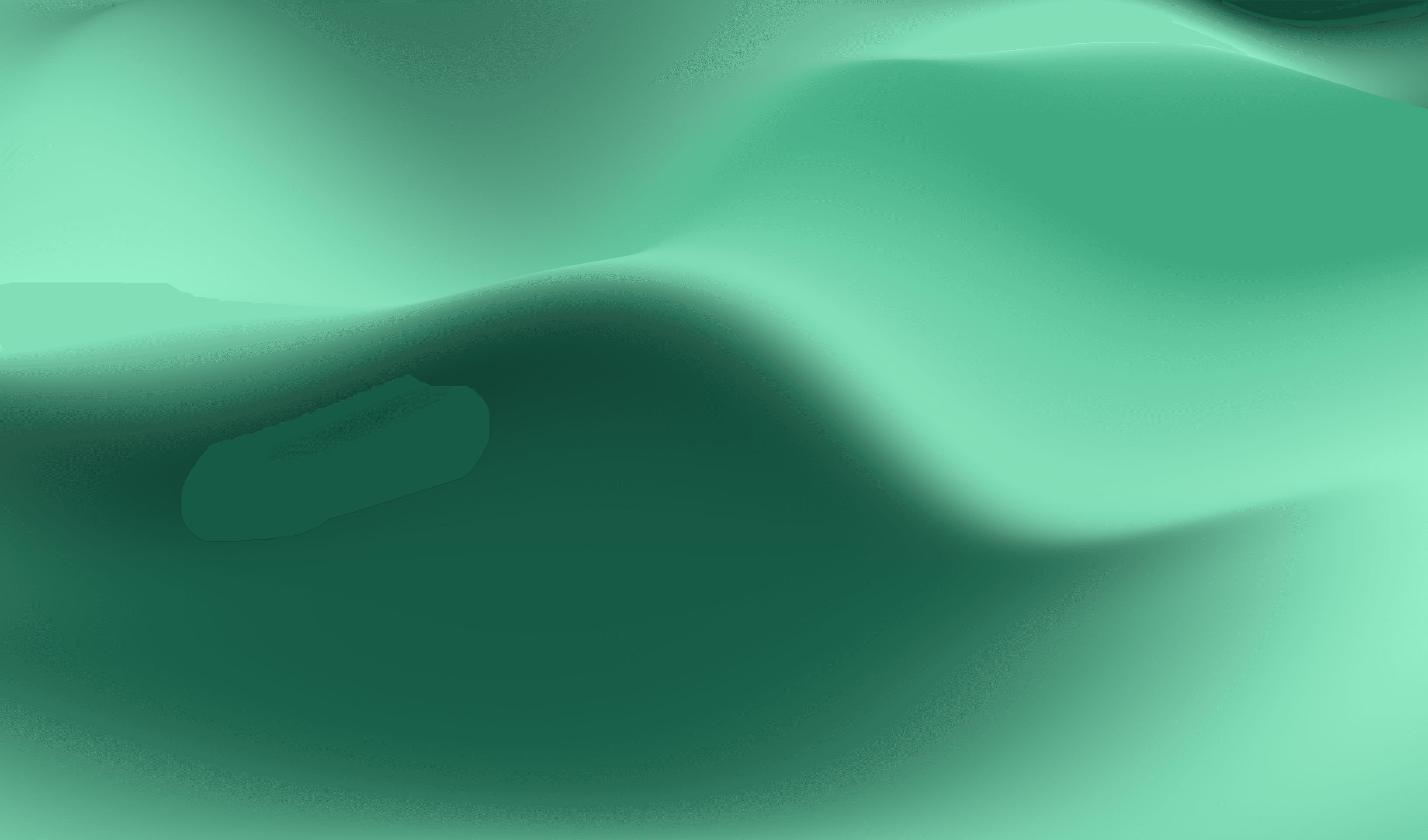 Laptop on a clean desk next to modern decor.