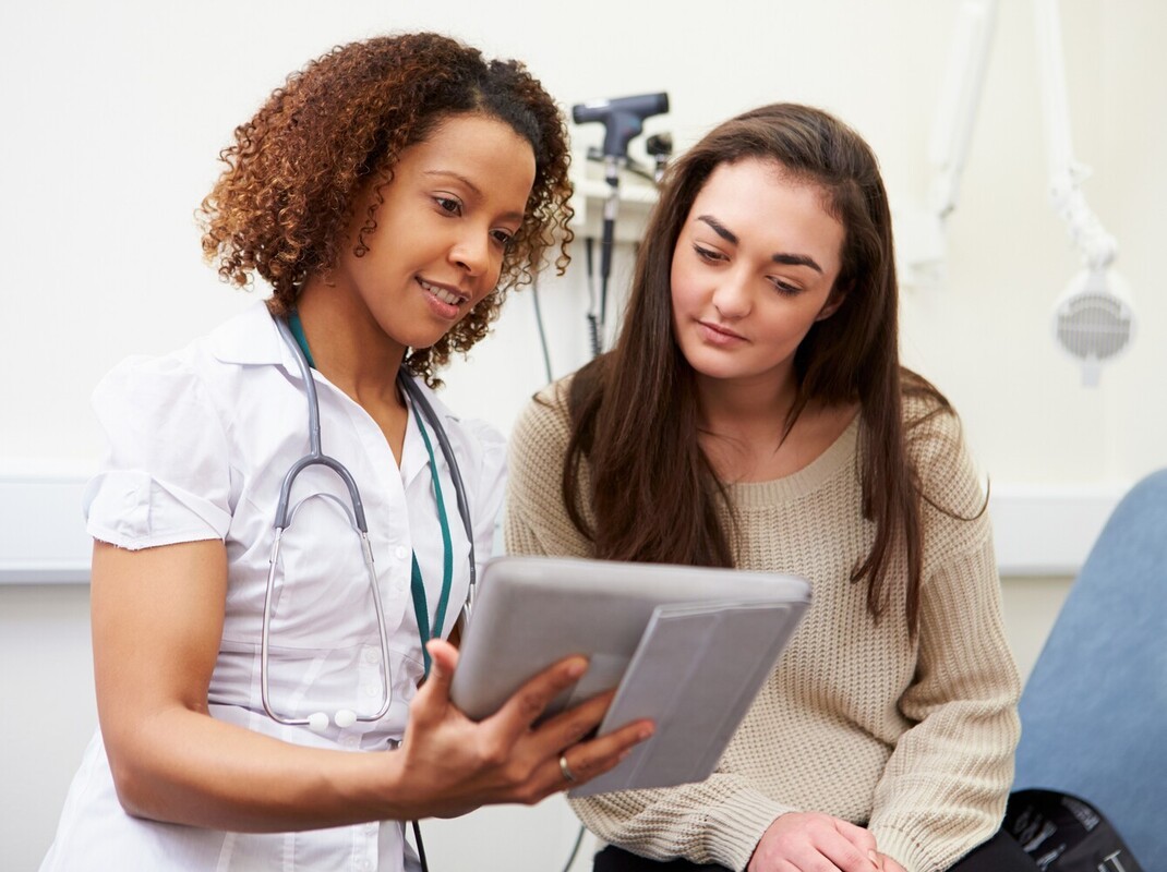 teenaged girl at a doctor’s appointment to monitor her prescribed weight loss medication