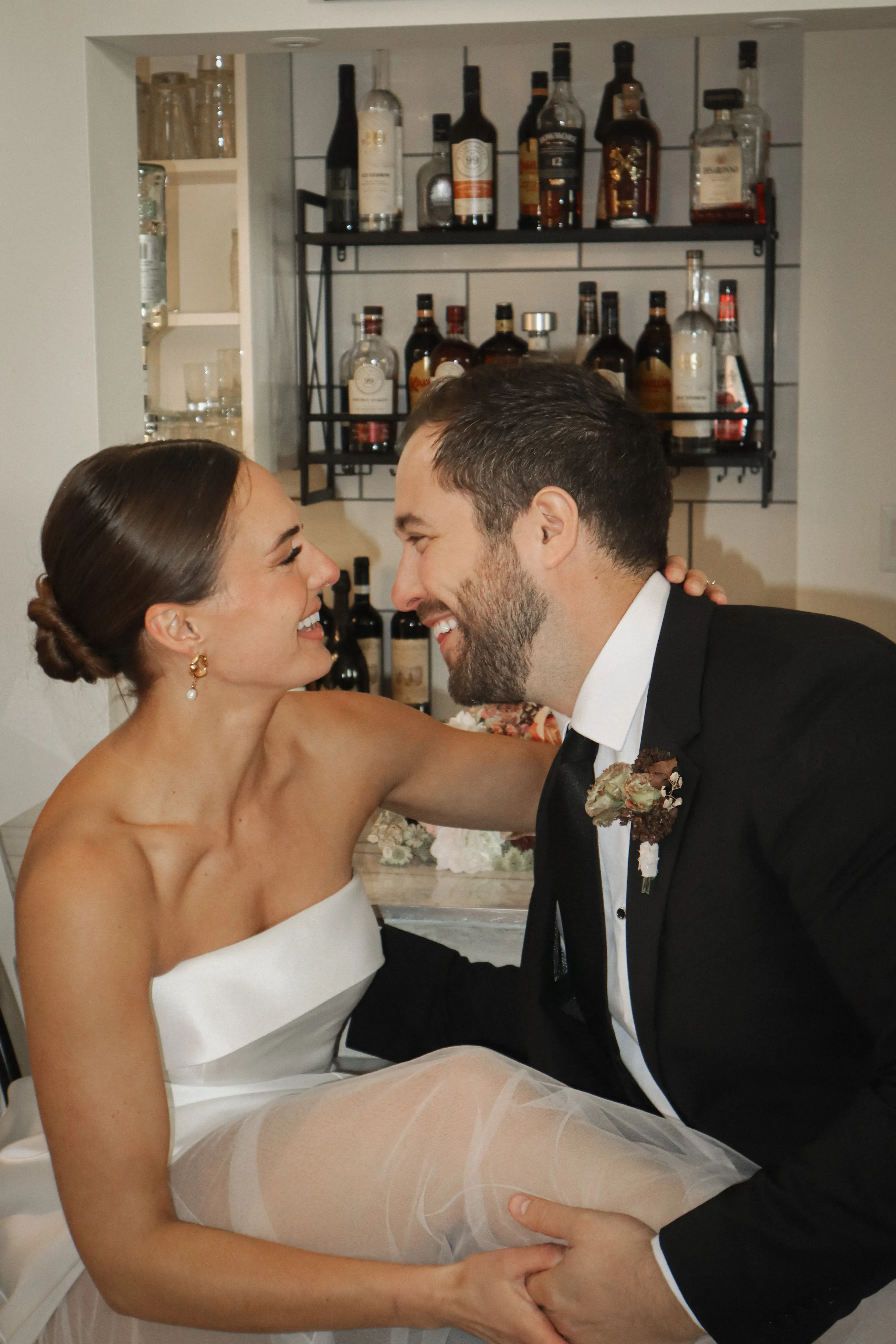 Couple celebrating their anniversay at Ashlar, sitting at the indoor bar counter