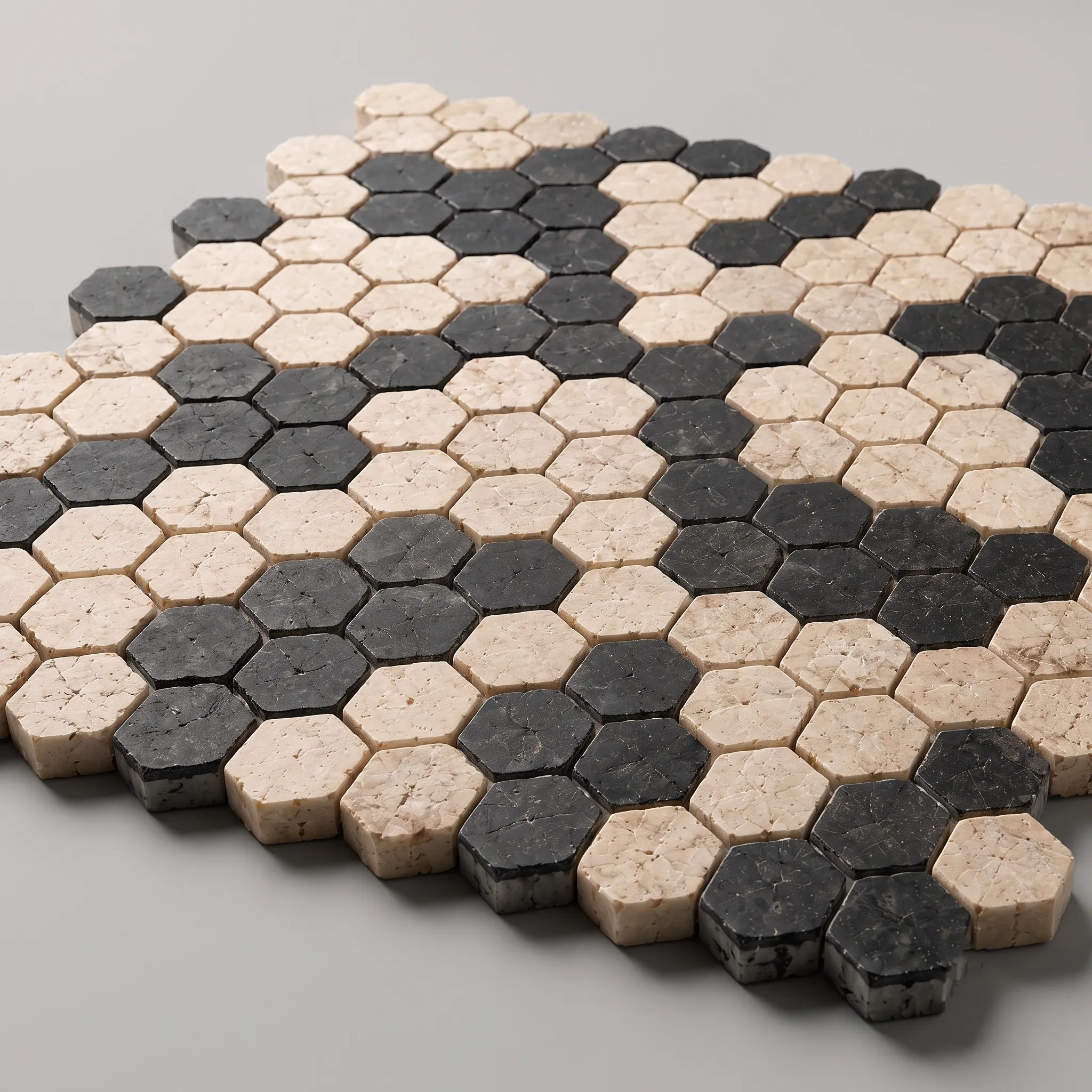 Close-up product view of Flowin beige and dark marble mosaic tiles arranged in a modular geometric pattern.
