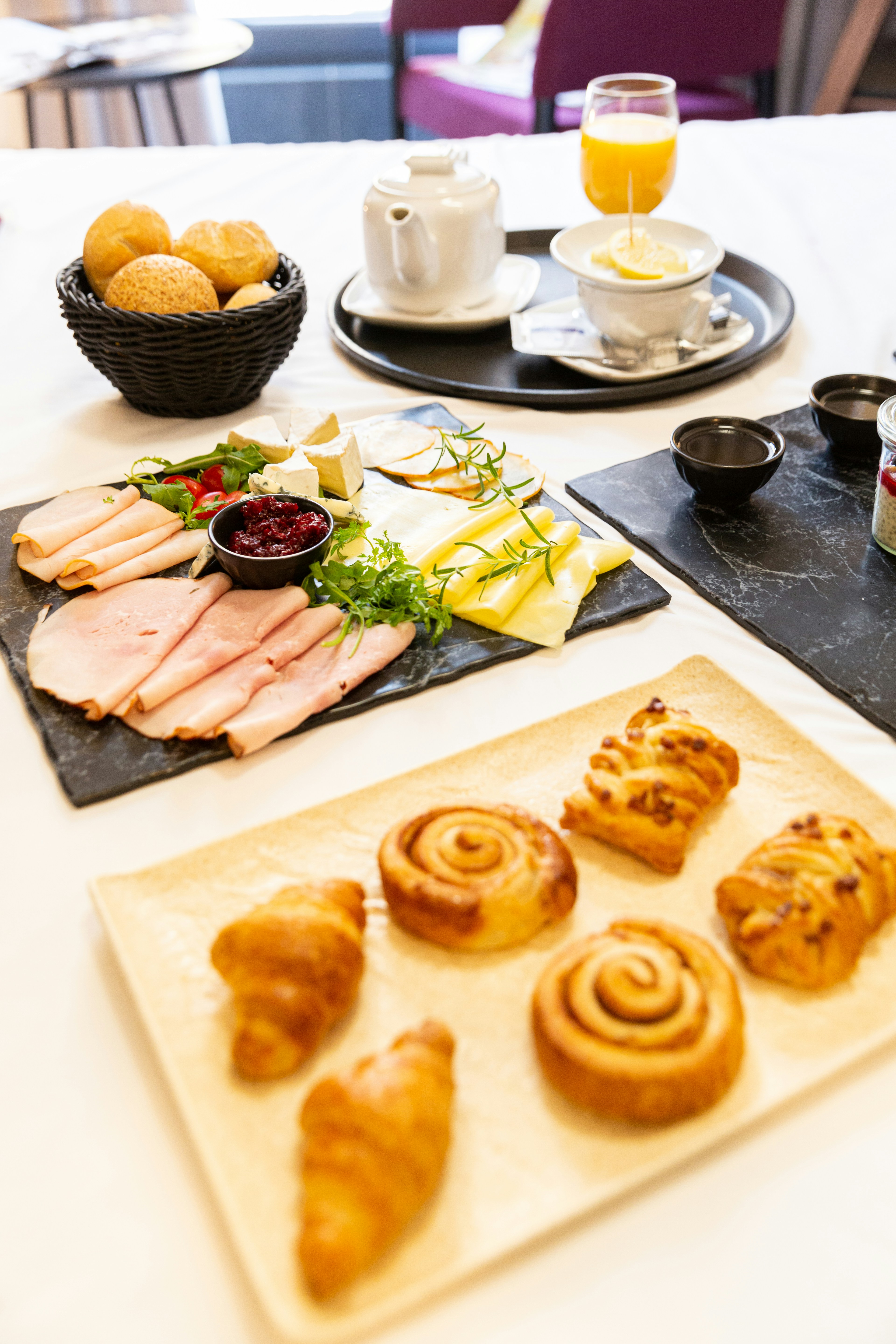 food platter of ham, cheese, and pastries