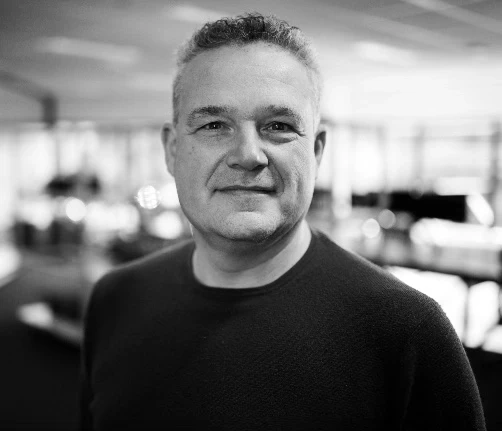 Black-and-white portrait of Trustethica trustworthy AI advisor Harm Ellens.