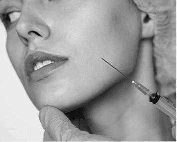 a woman sitting on a chair with her legs crossed