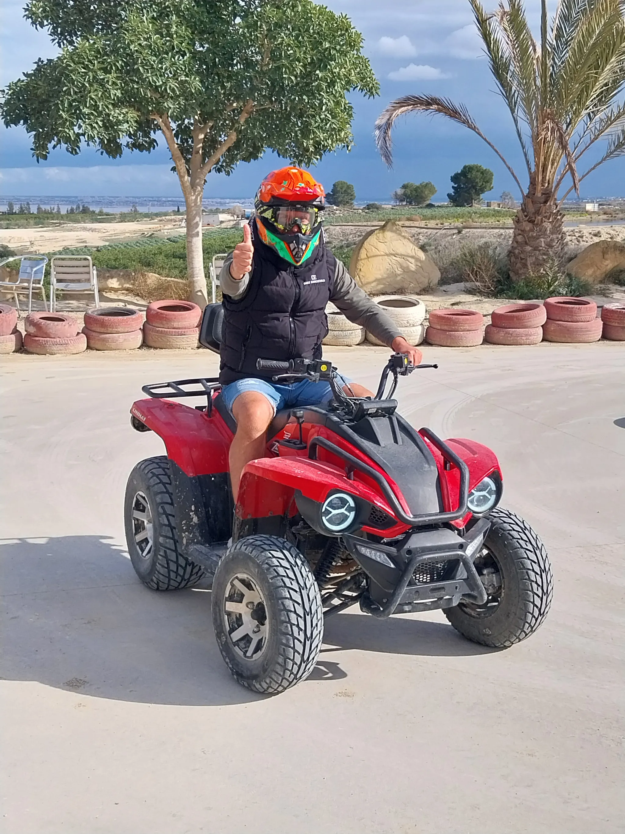 Minimalist living space with low modern furniture, large floor-to-ceiling windows, soft natural light, and an open view of a calm outdoor landscape.