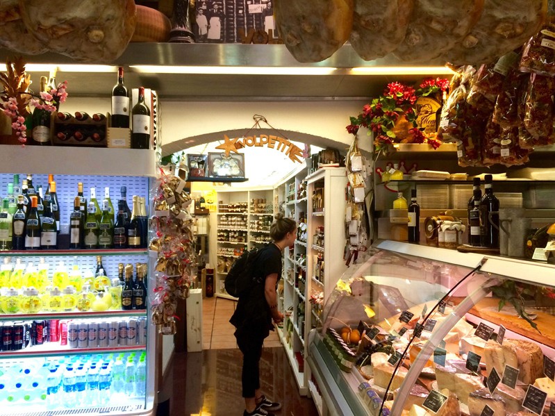 a woman cheese shopping